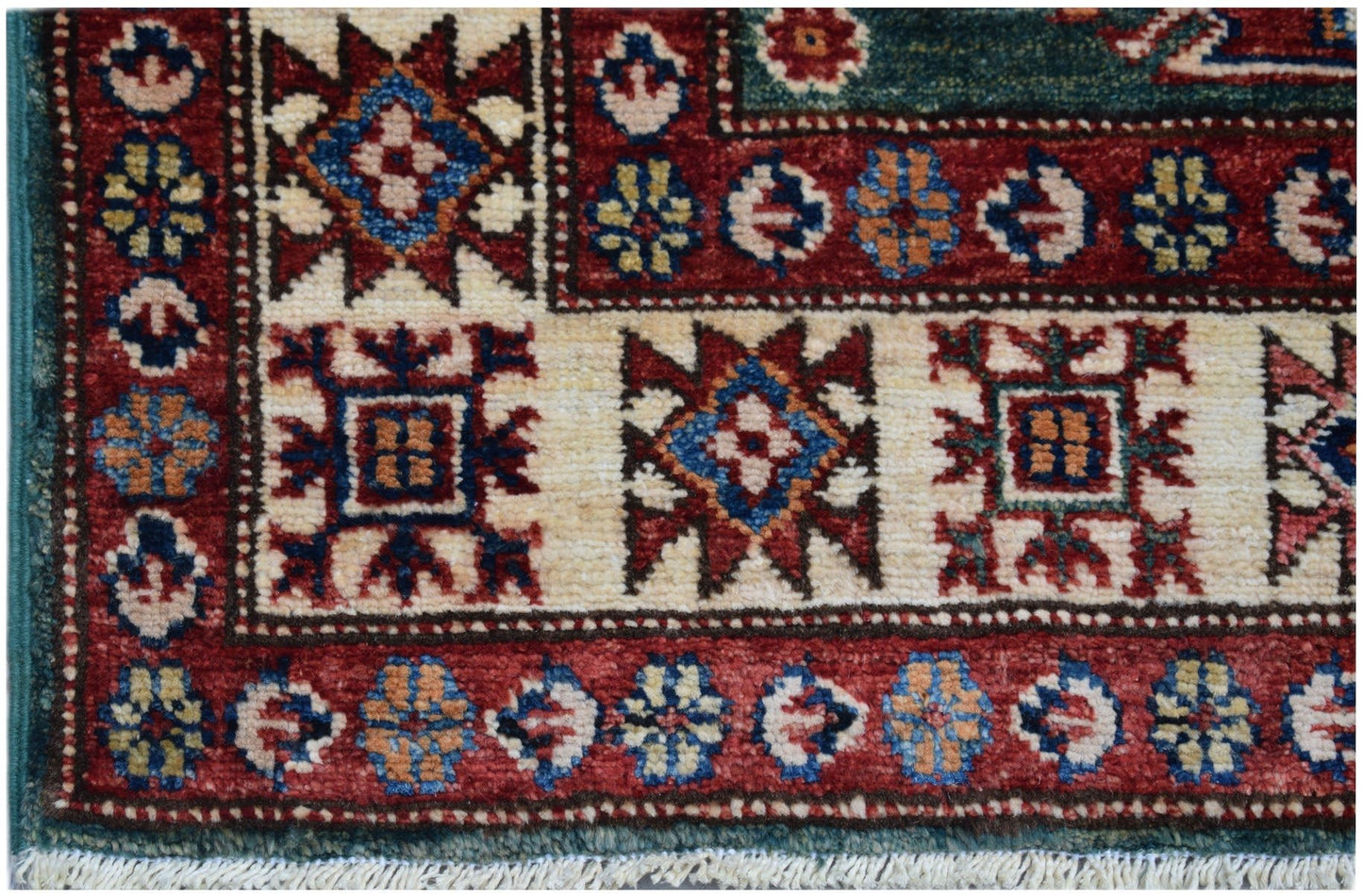 A handmade Afghan Super Kazakh runner featuring traditional geometric motifs in red and cream.