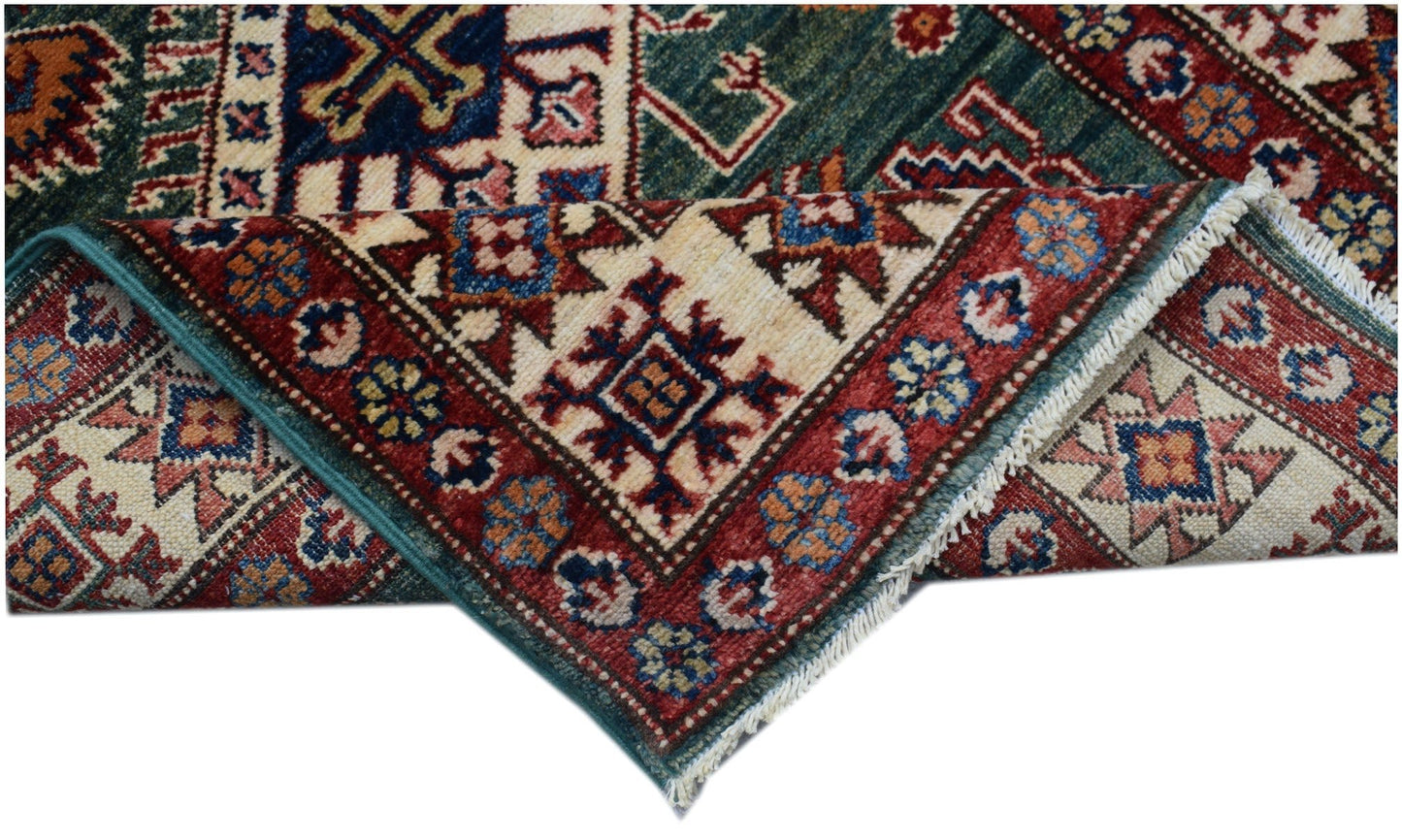 A handmade Afghan Super Kazakh runner featuring traditional geometric motifs in red and blue tones.