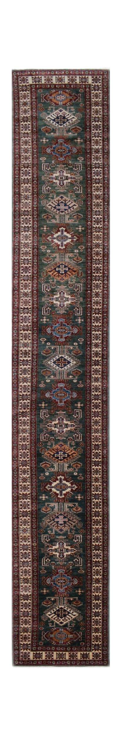 A long, handmade Afghan Super Kazakh runner rug featuring traditional geometric motifs in teal.