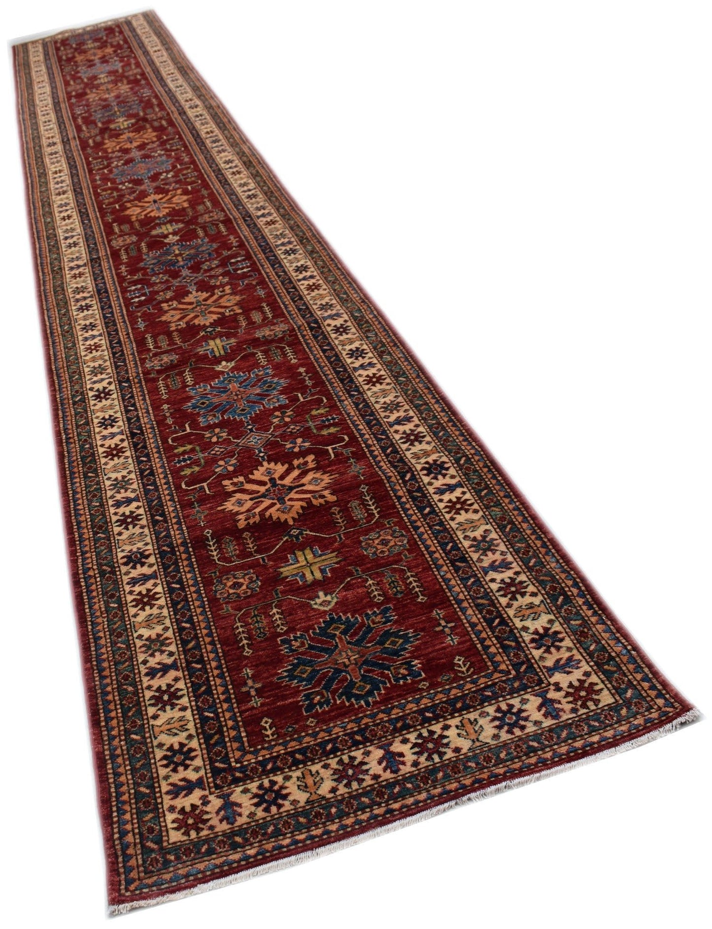 A long, handmade Afghan Super Kazakh runner rug featuring traditional geometric motifs in red.