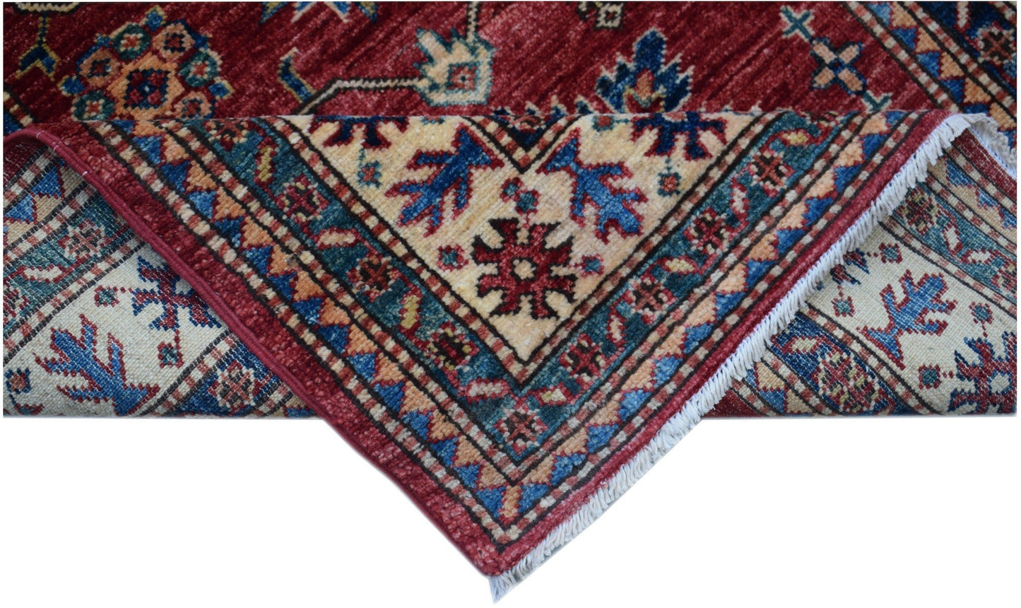 An Afghan Super Kazakh runner featuring traditional red, blue, and cream geometric patterns.