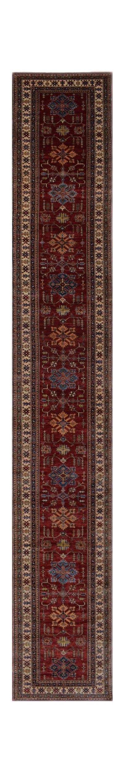 A long, handmade Afghan Super Kazakh runner rug featuring traditional geometric motifs in red.