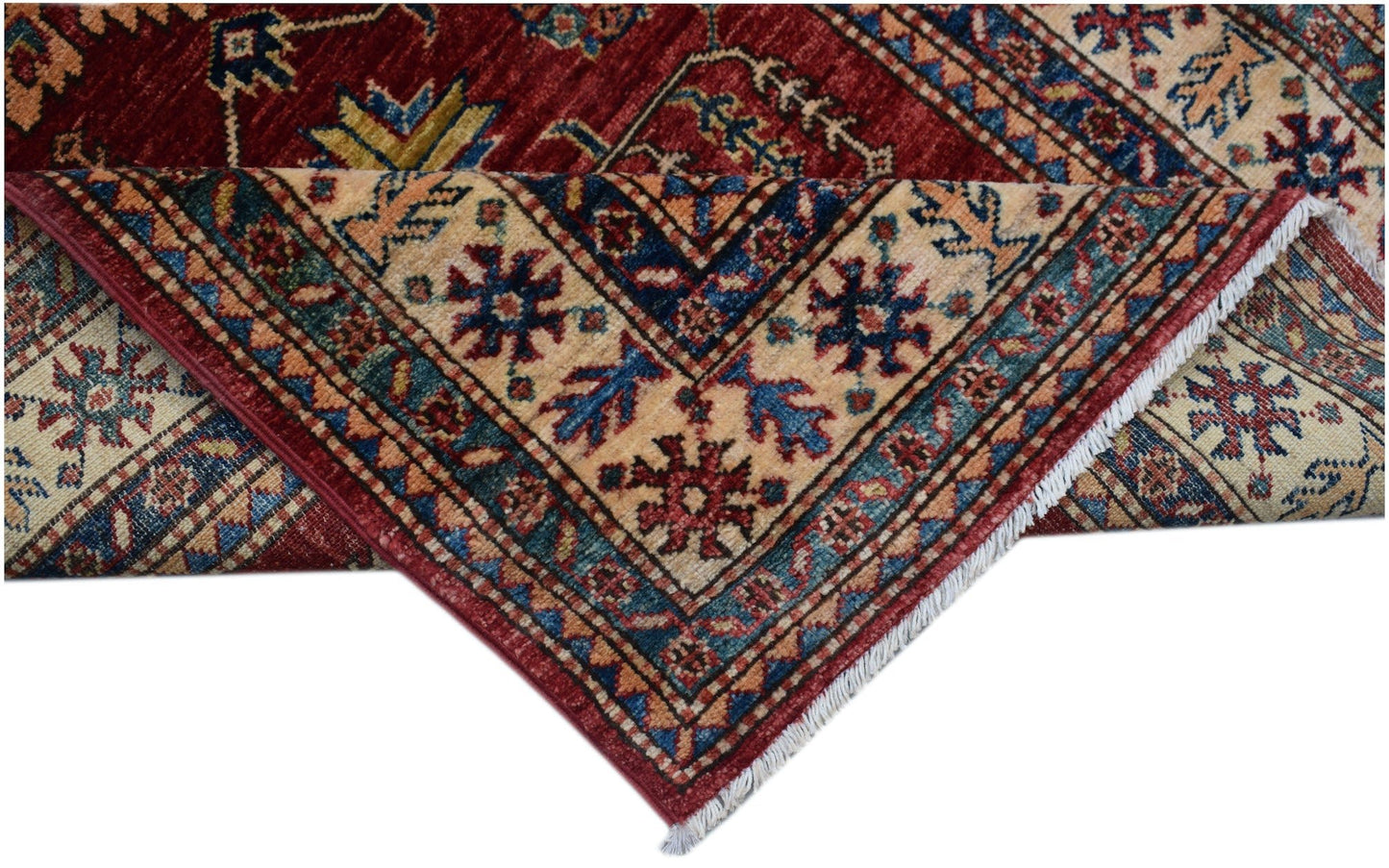 A folded Afghan Super Kazakh runner featuring traditional geometric motifs in red, blue, and cream.