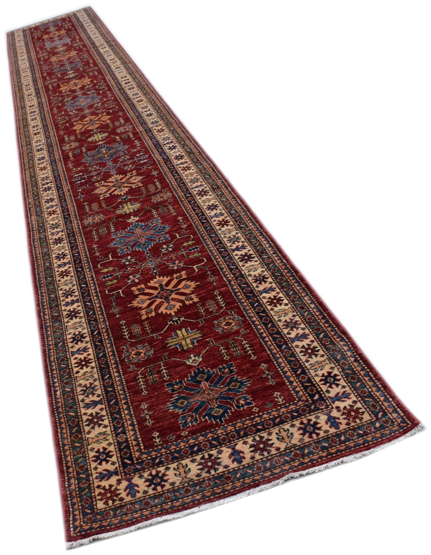 A long, handmade Afghan Super Kazakh runner rug featuring traditional geometric motifs in red.