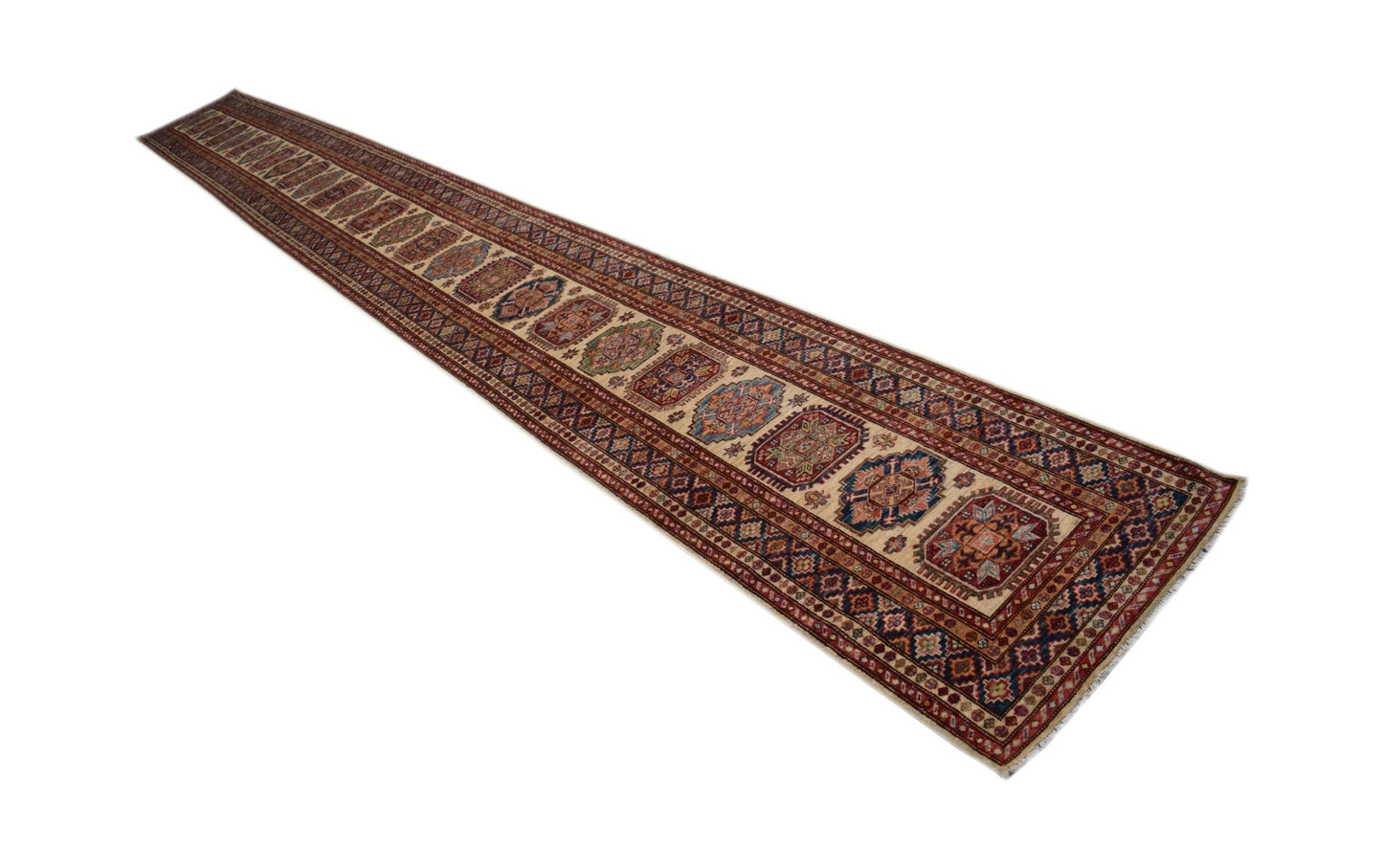 A long, handmade Afghan Super Kazakh runner rug featuring traditional geometric motifs in red, blue, and cream.
