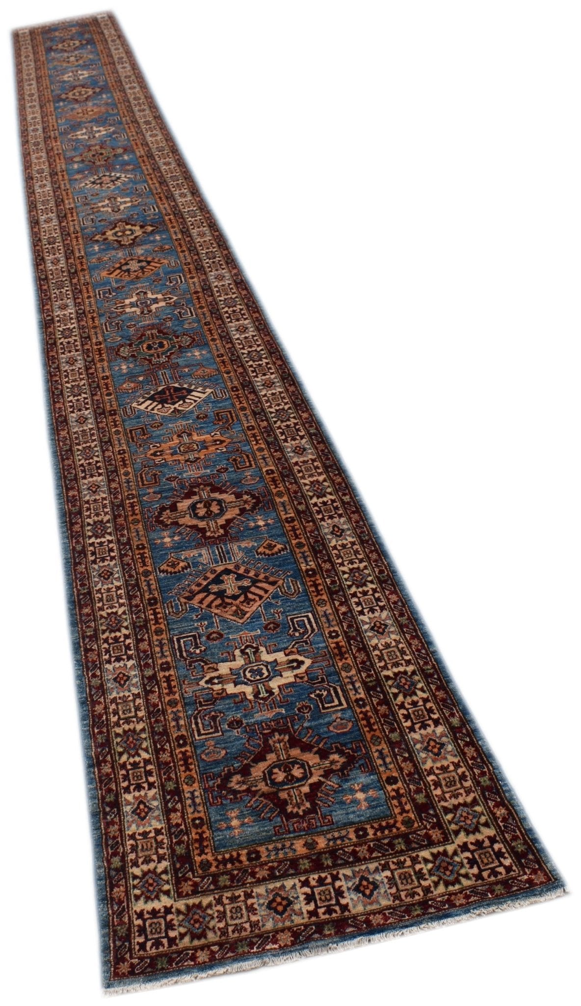 A long, handmade Afghan Super Kazakh runner rug featuring traditional geometric motifs in blue.
