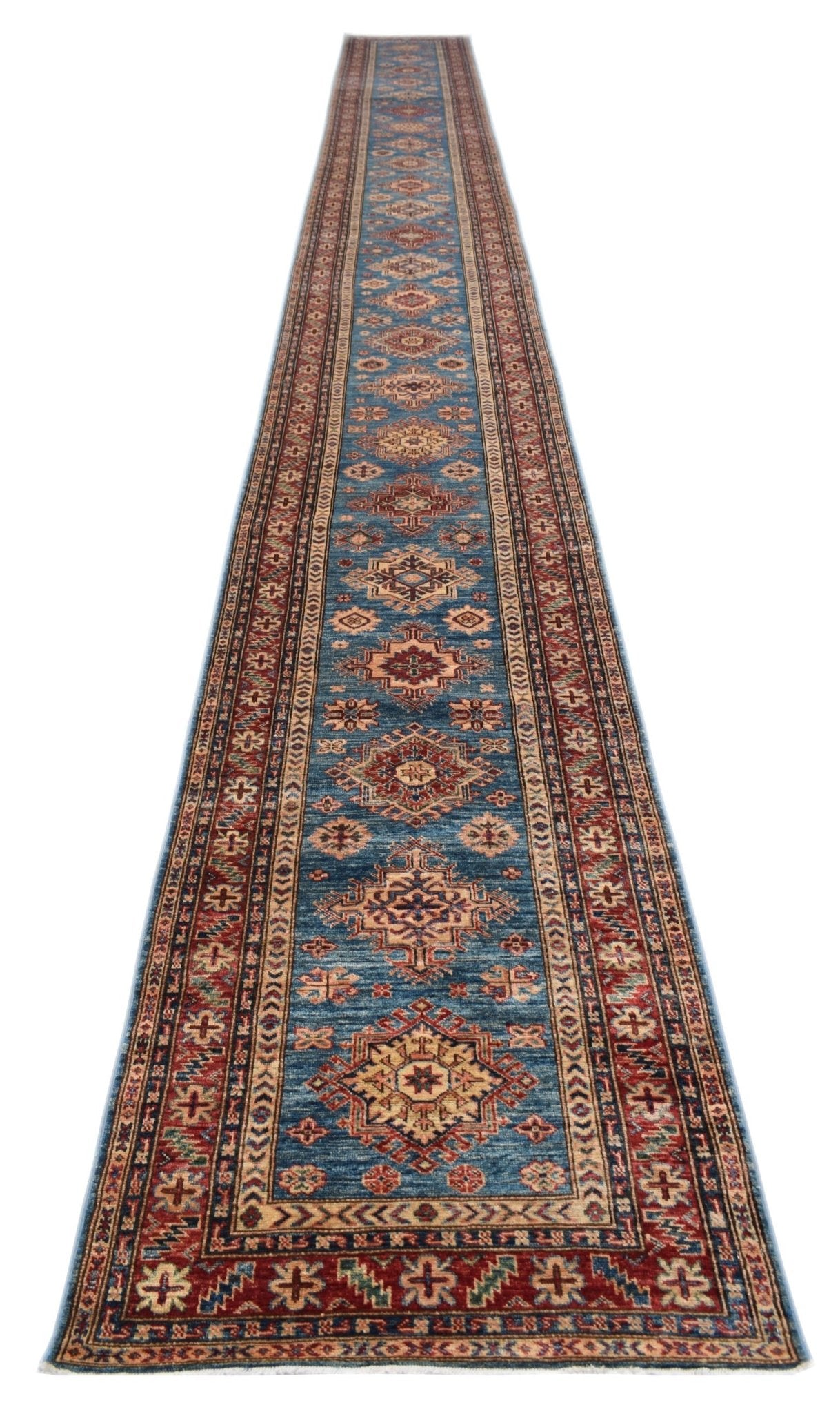 A long, handmade Afghan Super Kazakh runner rug featuring traditional geometric motifs in blue.