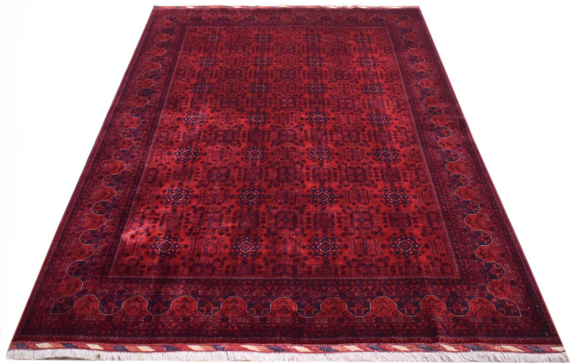 A handmade Afghan Biljik rug featuring a deep red field with intricate blue geometric patterns.
