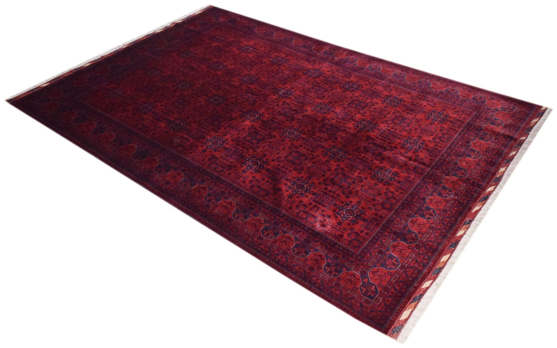 A rectangular handmade Afghan Biljik rug featuring a deep red field with intricate blue geometric patterns and fringed edges.