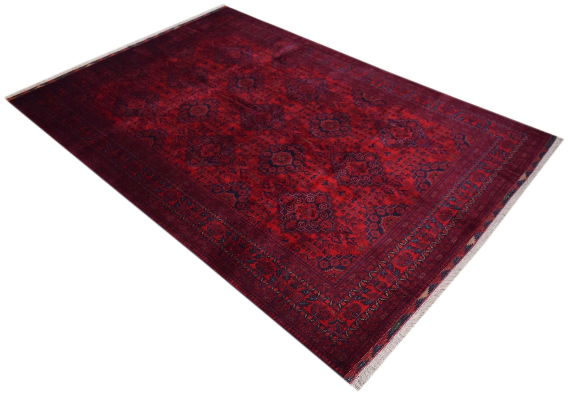 A handmade Afghan Biljik rug featuring intricate geometric patterns in deep red and blue tones.