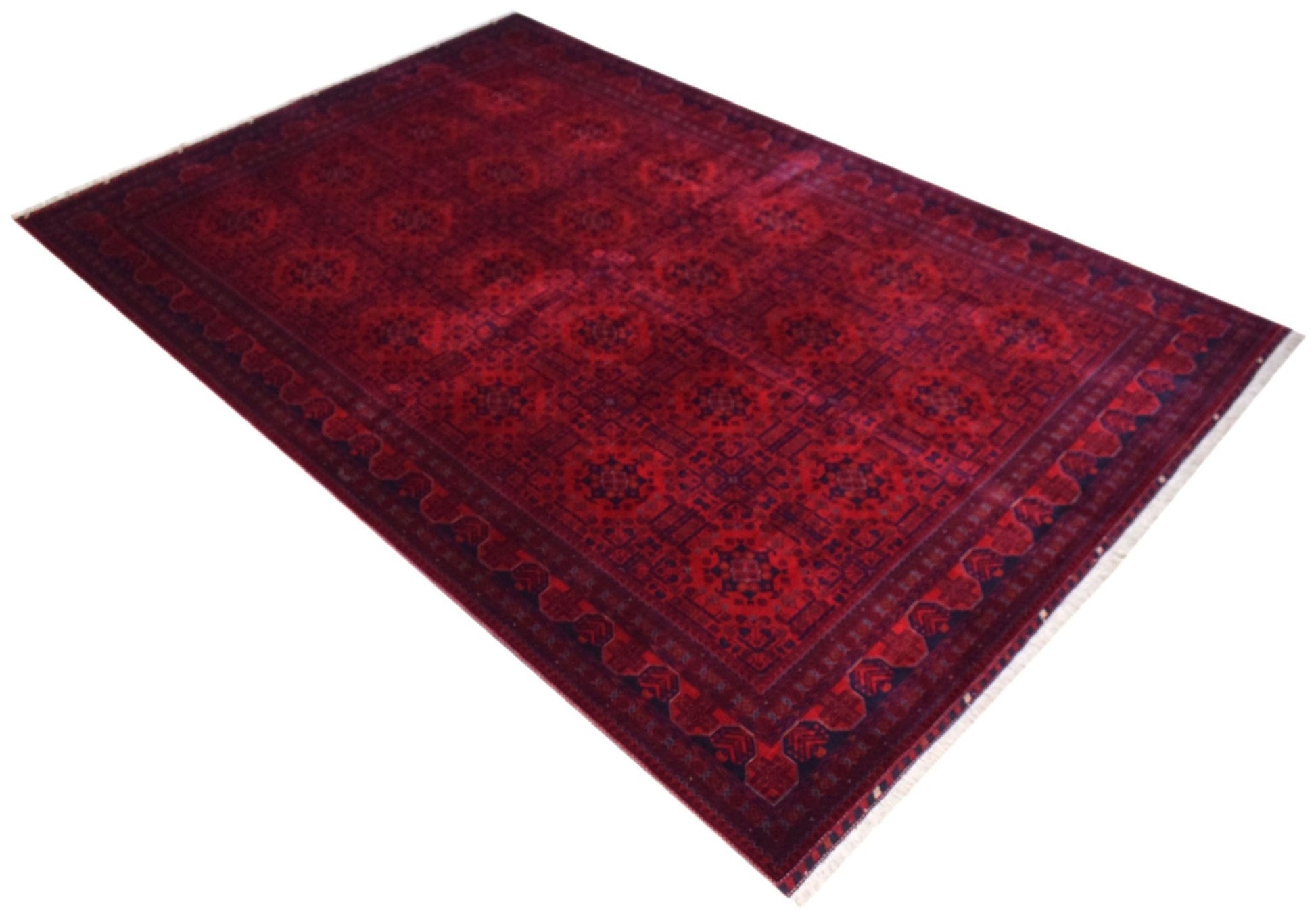 A handmade Afghan Biljik rug featuring a deep red field with intricate blue geometric patterns.