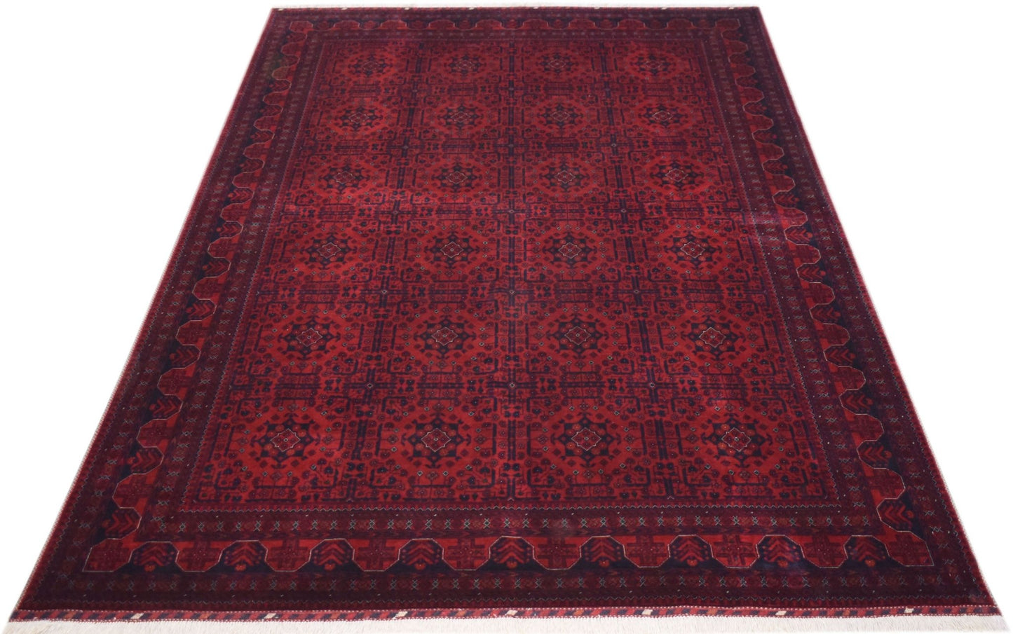 Handmade Afghan Biljik rug featuring a deep red field with intricate geometric patterns in blue.