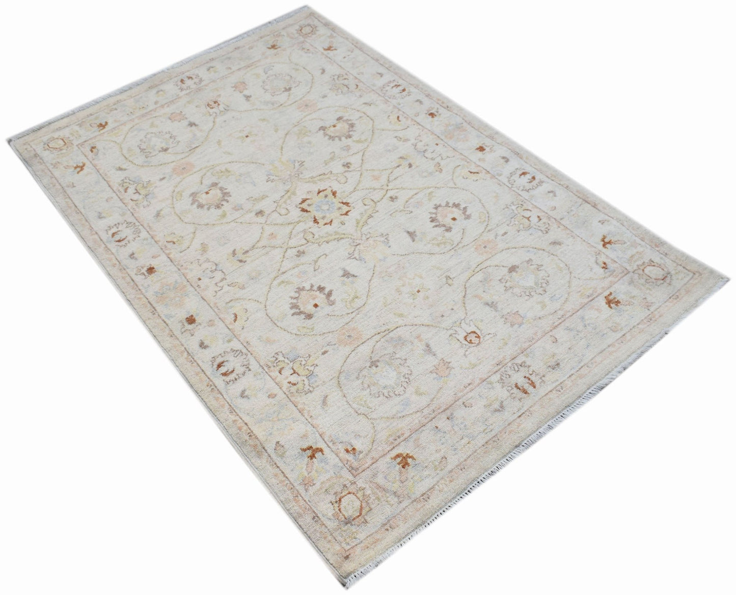A rectangular Afghan Chobi rug featuring traditional floral patterns in soft, earthy tones.