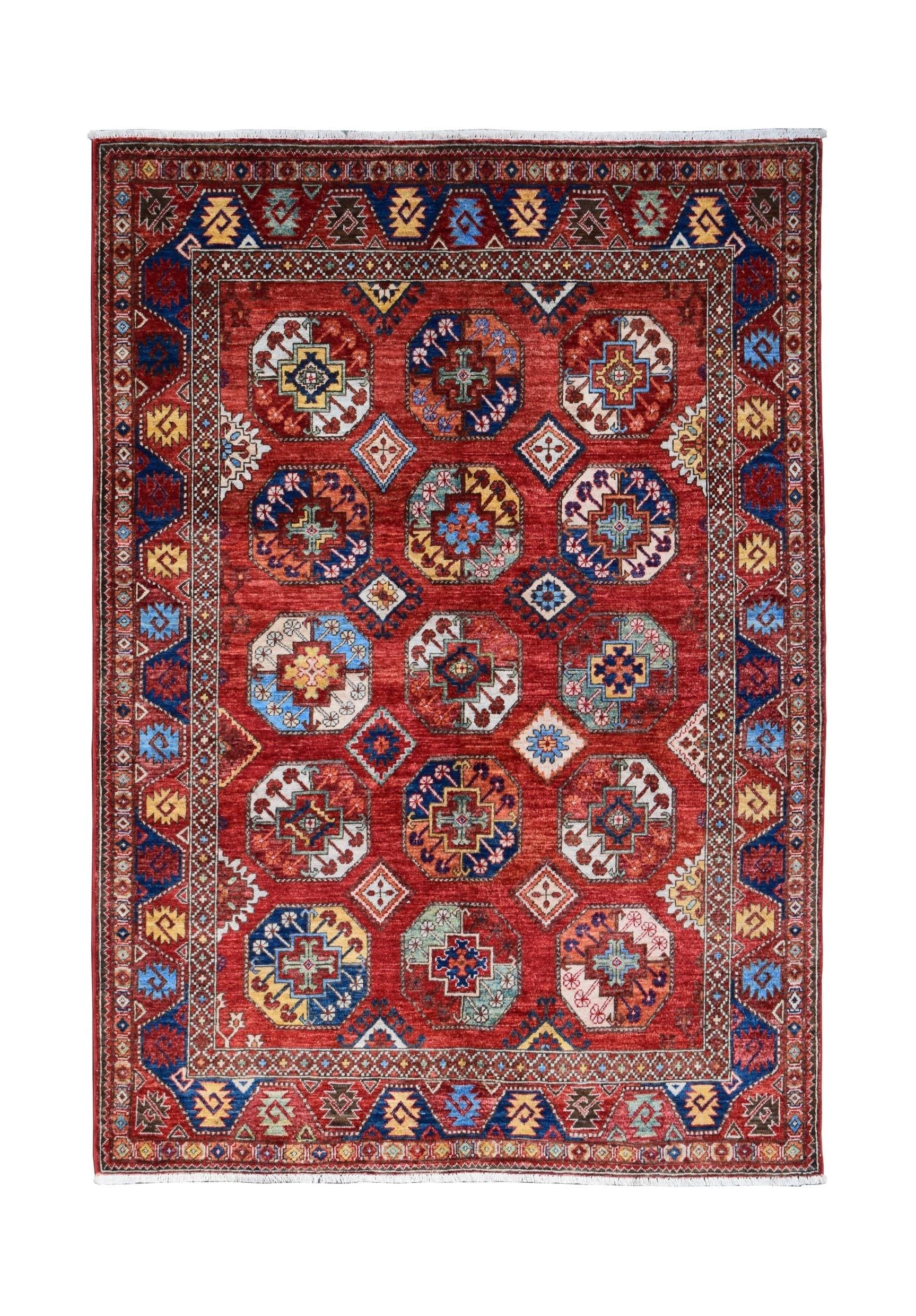 Handmade Afghan Chobi rug featuring a red field with repeating geometric octagonal motifs.