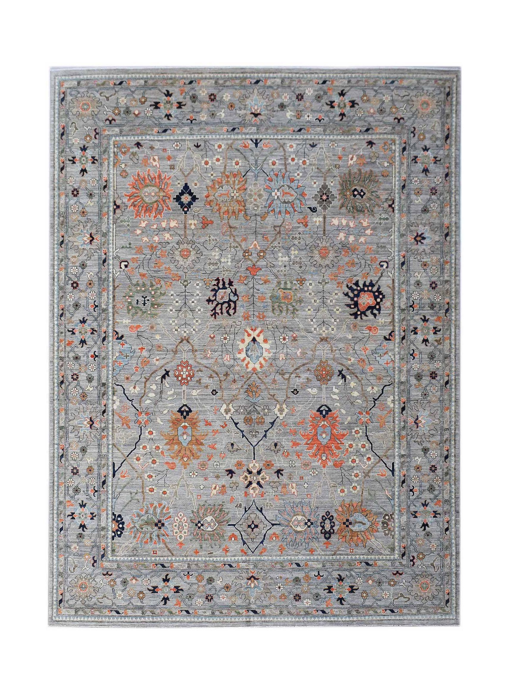 A handwoven Afghan Chobi rug featuring a traditional floral pattern in muted tones on a grey field.