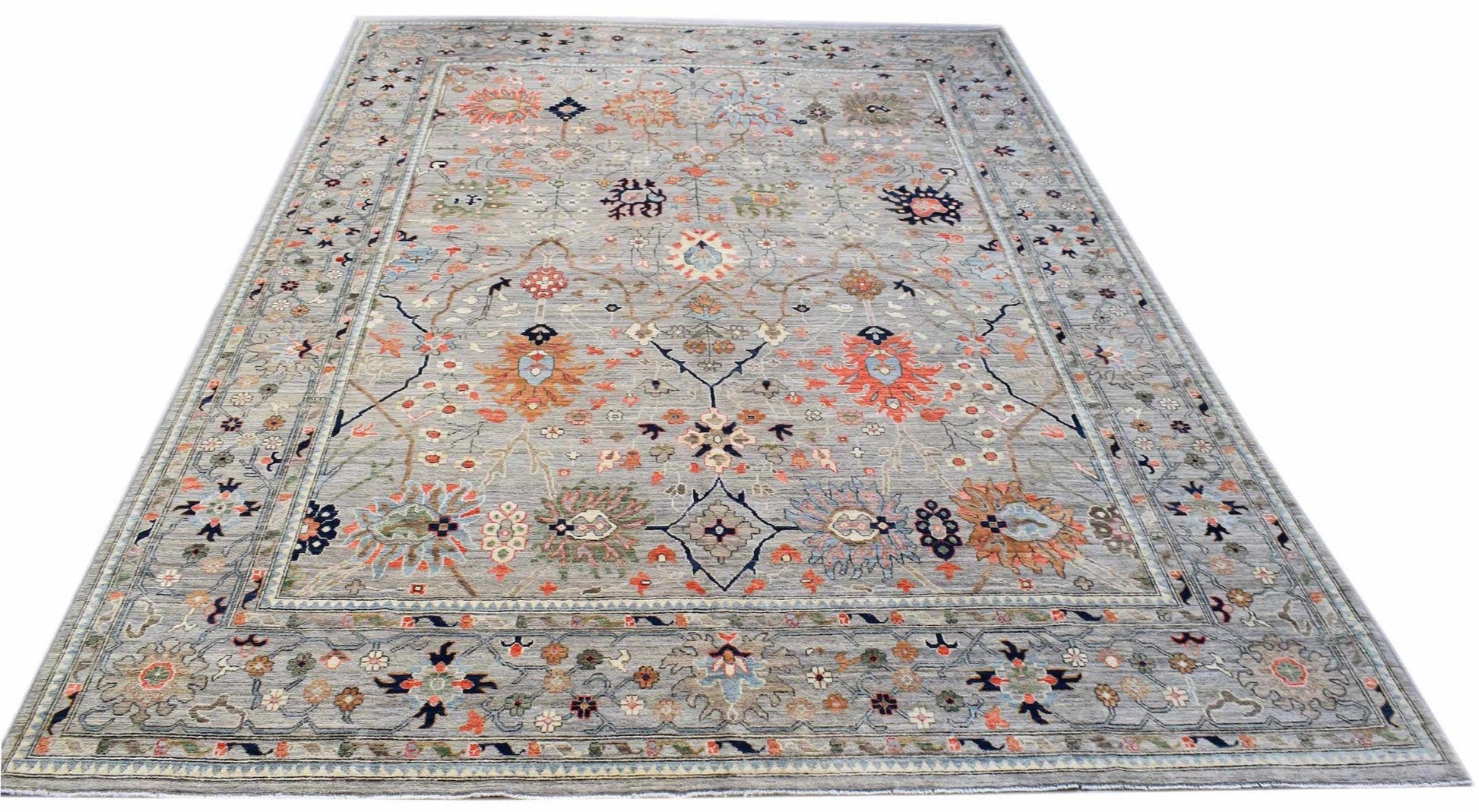 A rectangular Afghan Chobi rug featuring a traditional floral pattern in muted earth tones.