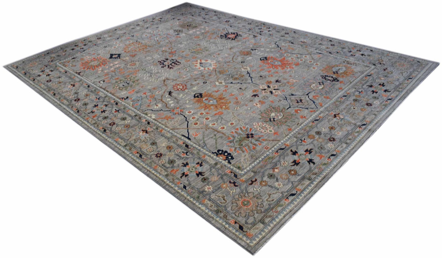A rectangular Afghan Chobi rug featuring a traditional floral pattern in muted earth tones.