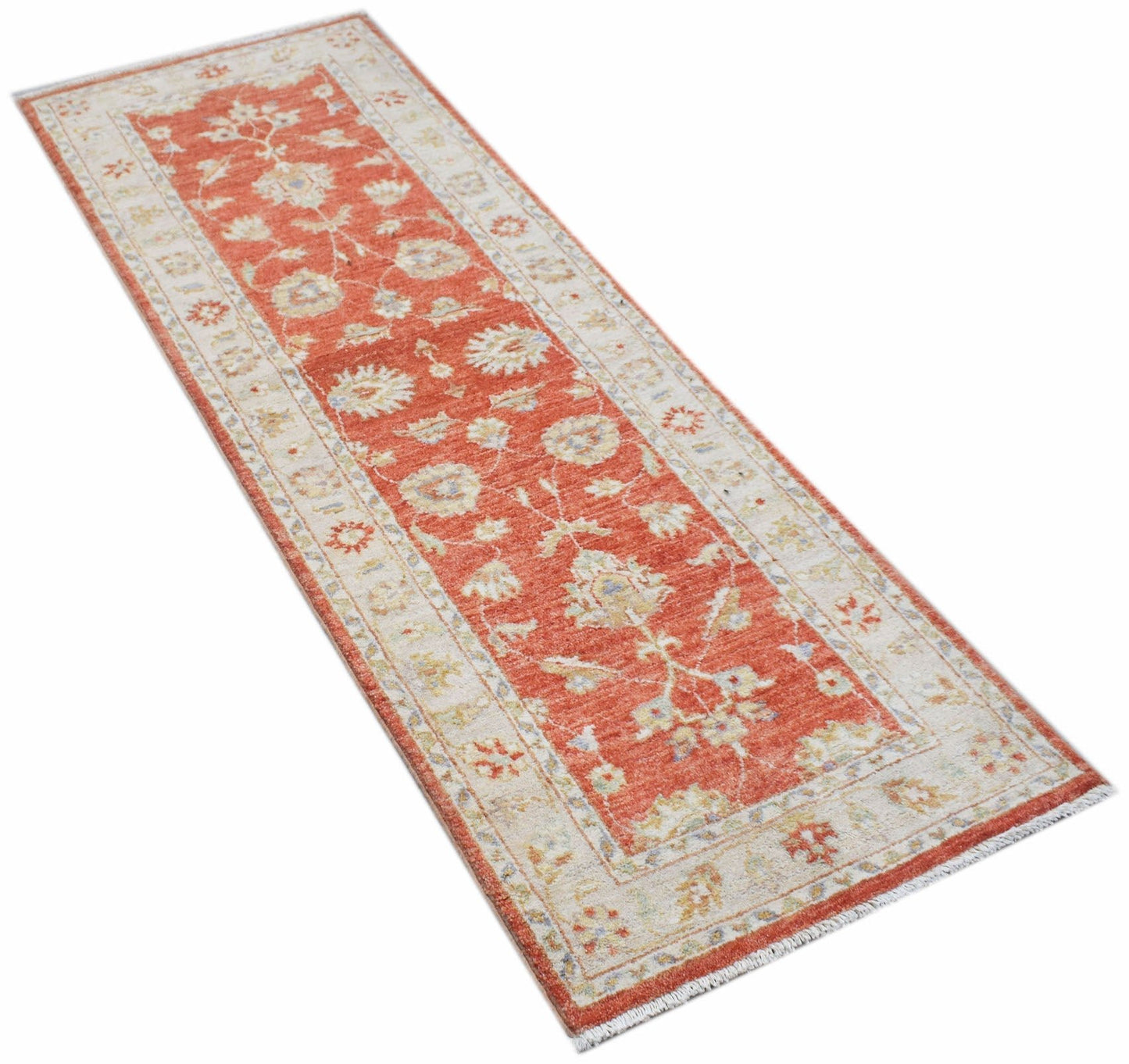 A handmade Afghan Chobi runner rug featuring a traditional floral pattern in orange and cream tones.