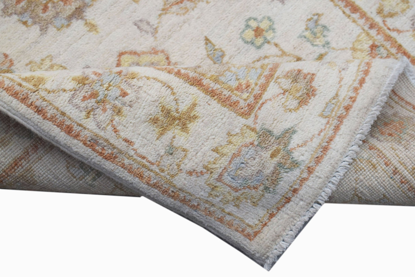 A handwoven Afghan Chobi runner featuring a traditional floral pattern in soft, earthy tones.