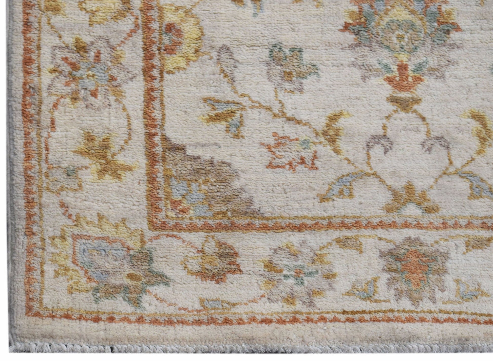 A handmade Afghan Chobi runner featuring a traditional floral pattern in soft, earthy tones.