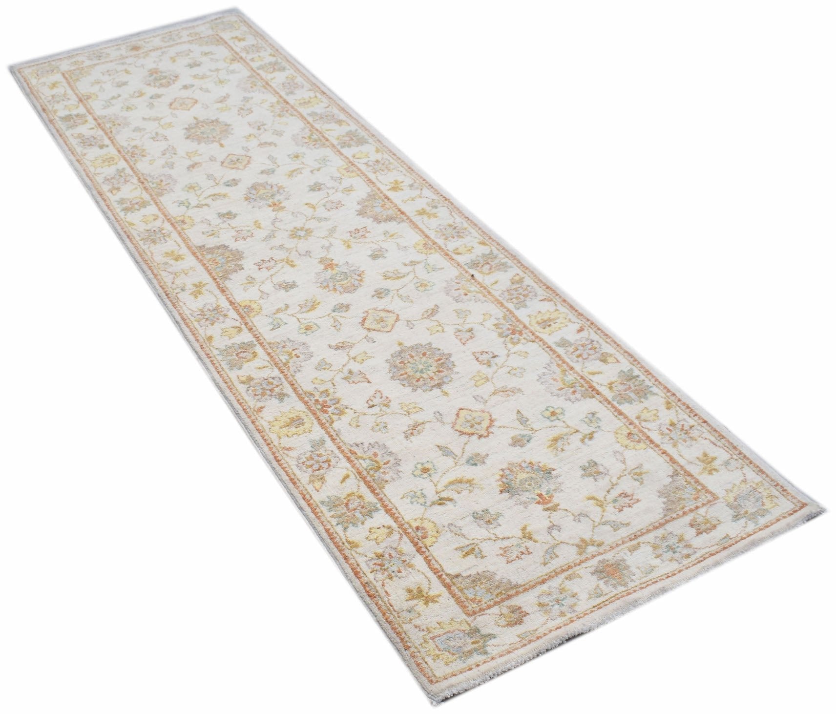 An Afghan Chobi runner rug featuring a traditional floral pattern in soft, muted earth tones.