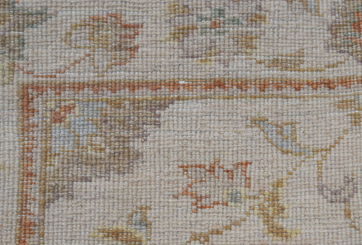 A close-up of a handwoven Afghan Chobi runner featuring traditional patterns in earthy tones.