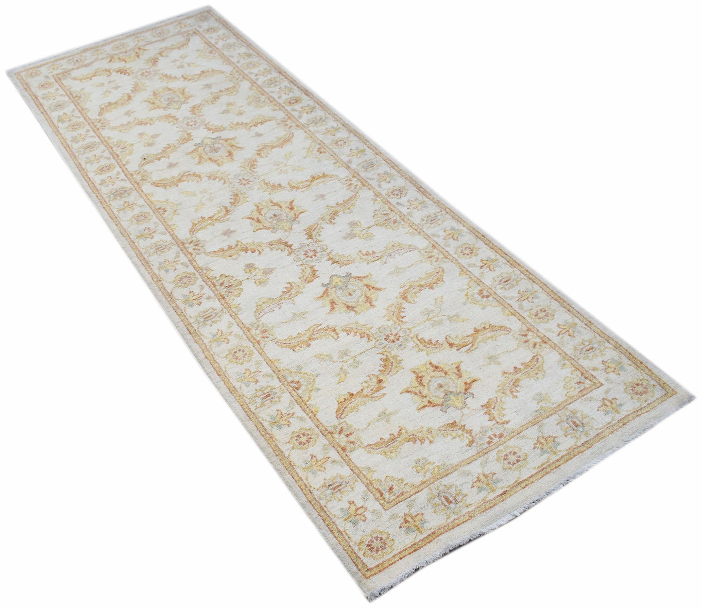A handmade Afghan Chobi runner rug featuring traditional floral patterns in soft earthy tones.