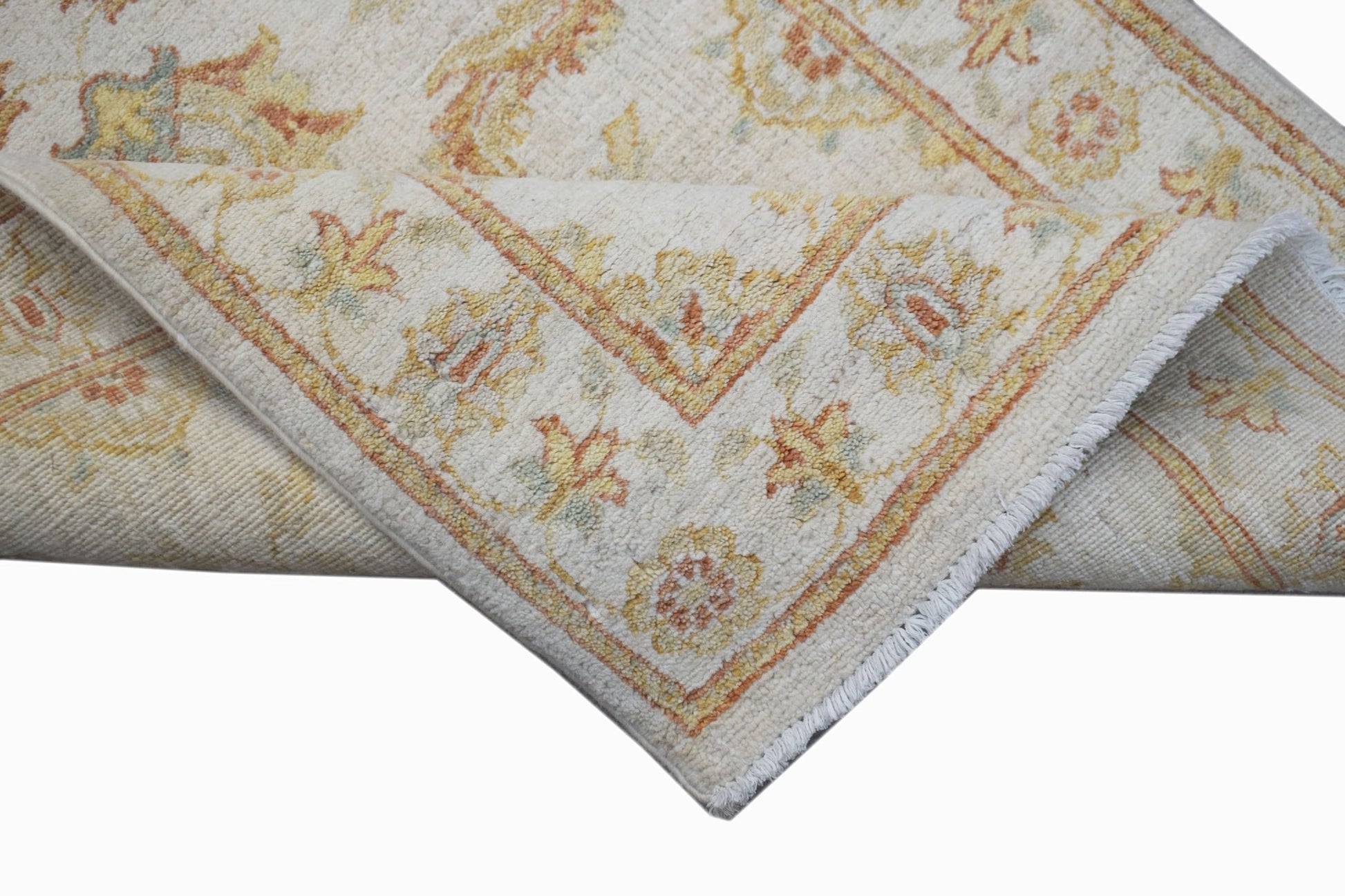A handwoven Afghan Chobi runner featuring traditional floral patterns in soft earth tones.