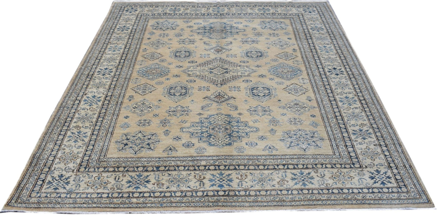 A handmade Afghan Super Kazakh rug featuring traditional blue geometric motifs on a beige field.