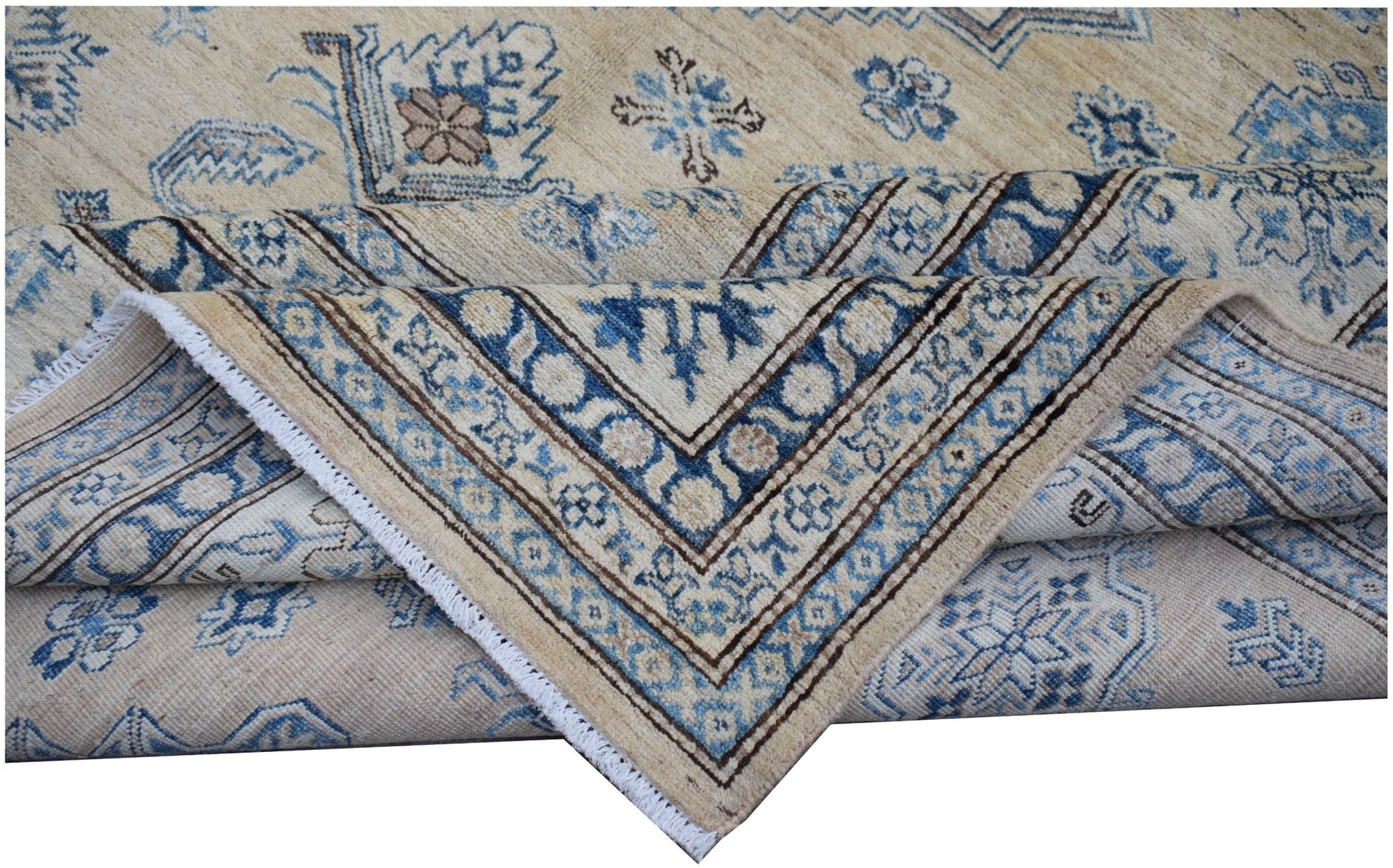 A handmade Afghan Super Kazakh rug featuring traditional blue and beige geometric patterns.