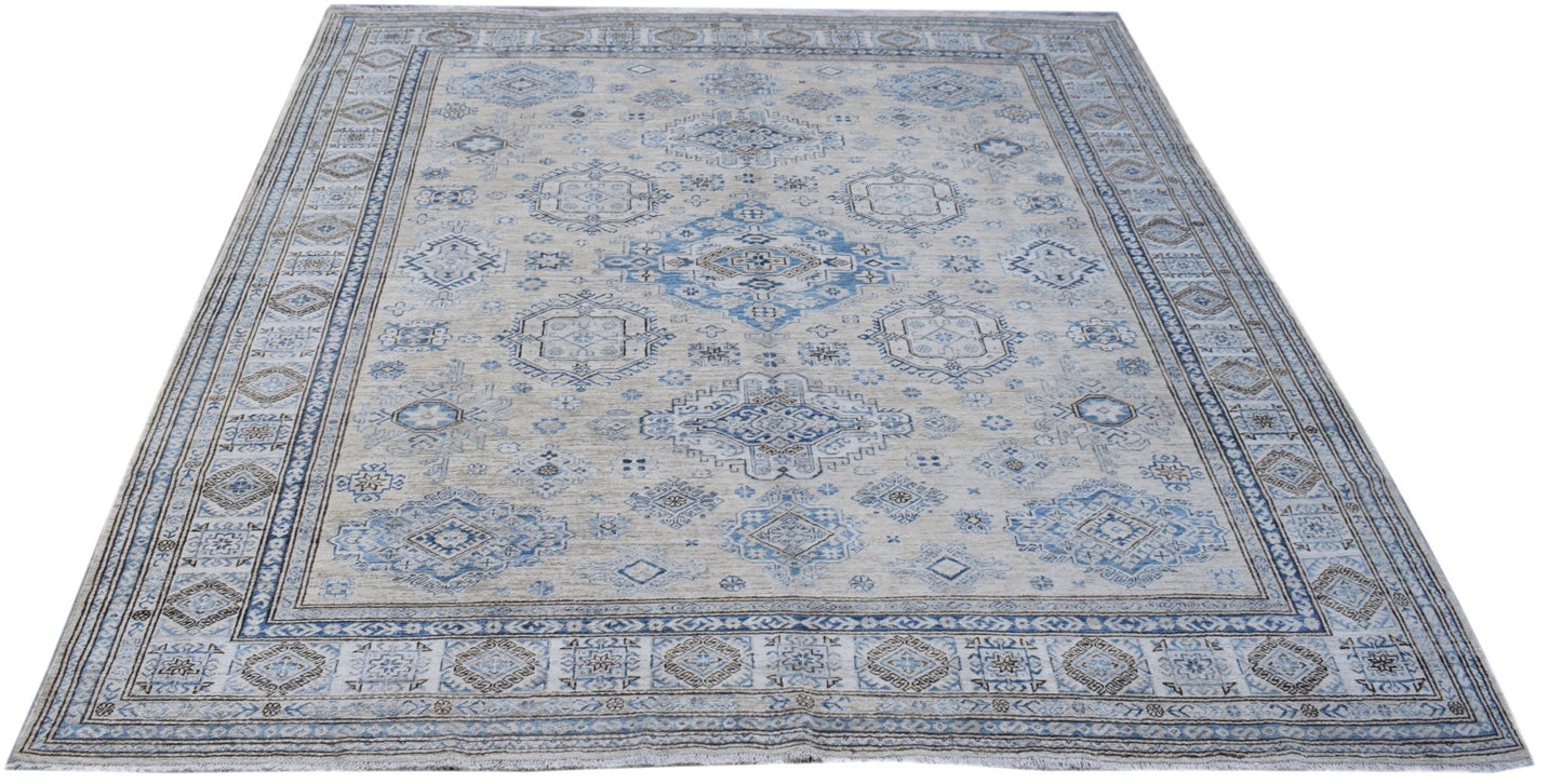 A handmade Afghan Super Kazakh rug featuring traditional blue and beige geometric patterns.
