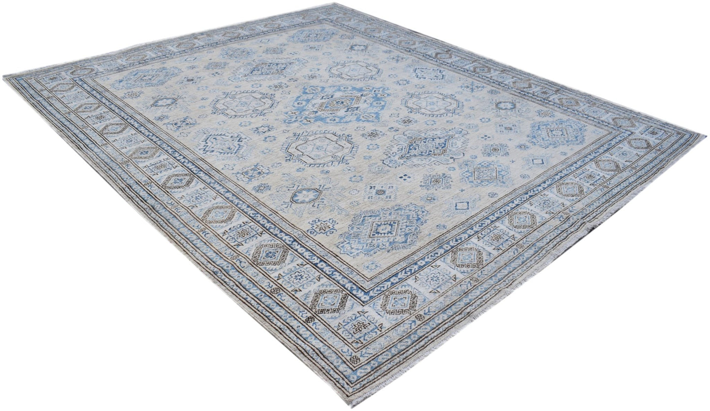 An Afghan Super Kazakh rug featuring traditional blue and beige geometric patterns.