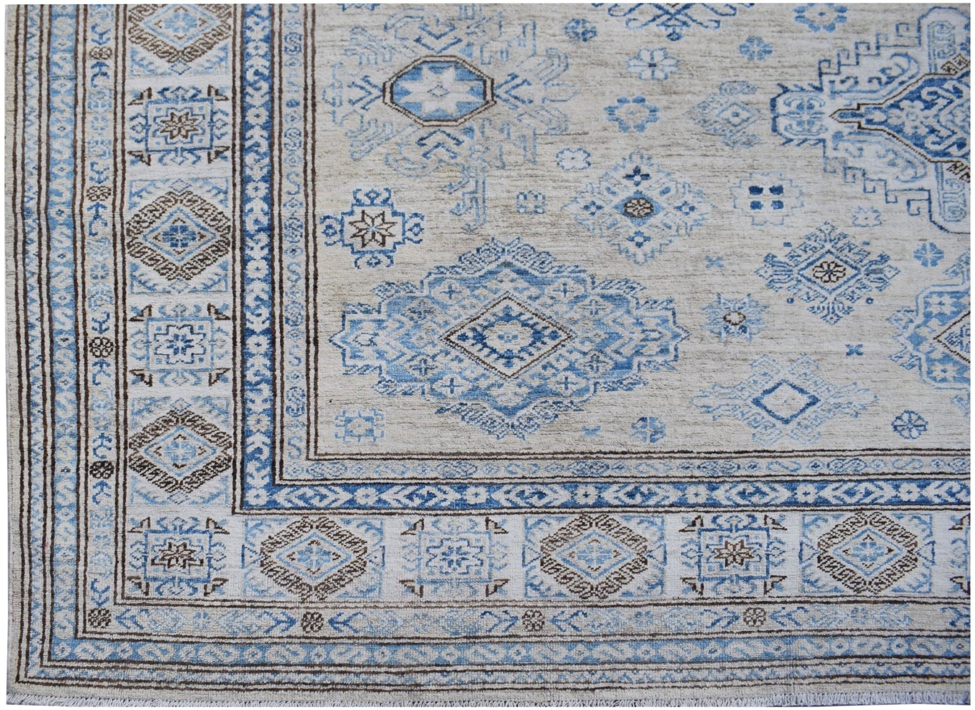 Handmade Afghan Super Kazakh wool rug featuring traditional blue and brown geometric motifs.
