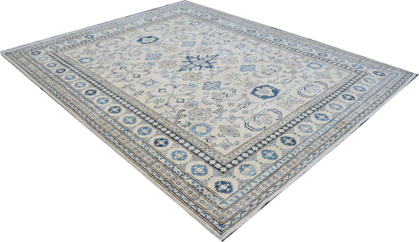An Afghan Super Kazakh rug featuring traditional blue and beige geometric patterns.