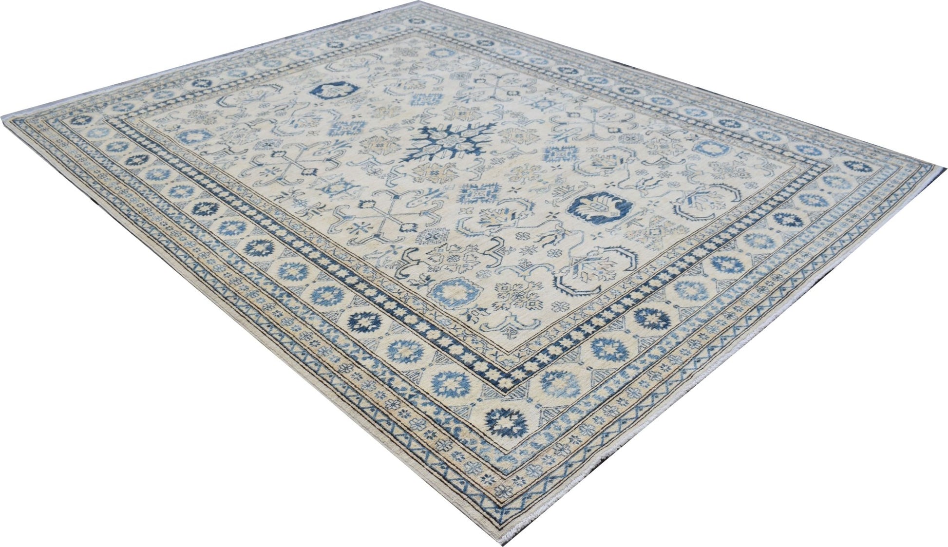 An Afghan Super Kazakh rug featuring traditional blue and beige geometric patterns.
