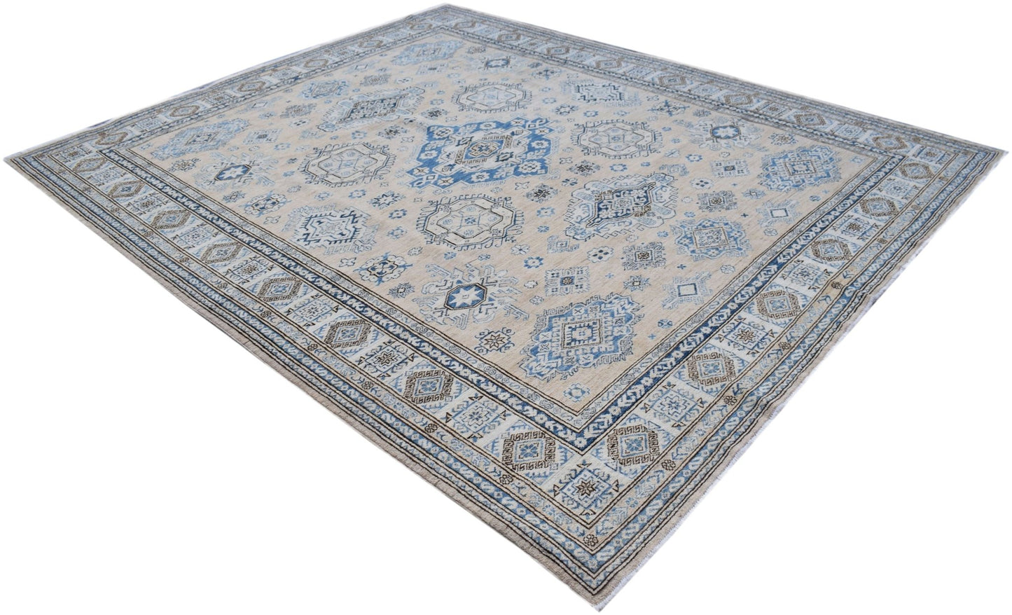 Handmade Afghan Super Kazakh rug featuring traditional blue and beige geometric patterns.