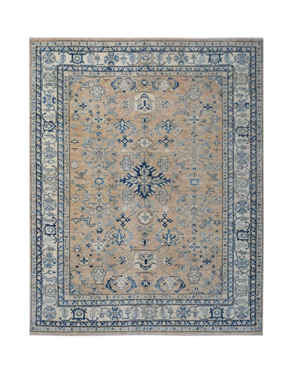 A handmade Afghan Super Kazakh rug featuring traditional blue geometric motifs on a tan background.