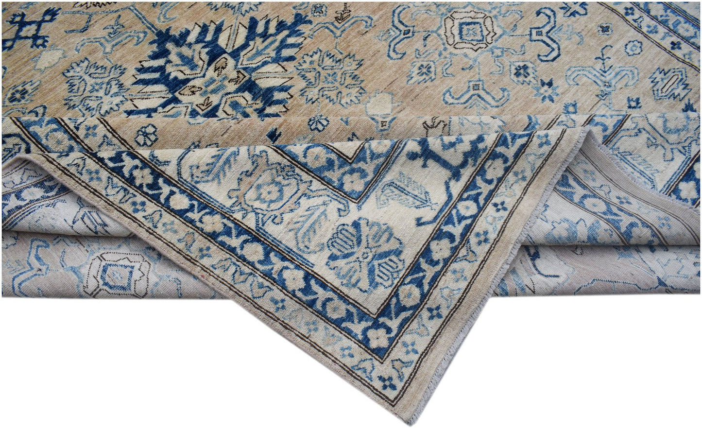 A handmade Afghan Super Kazakh rug featuring traditional blue and beige geometric patterns.