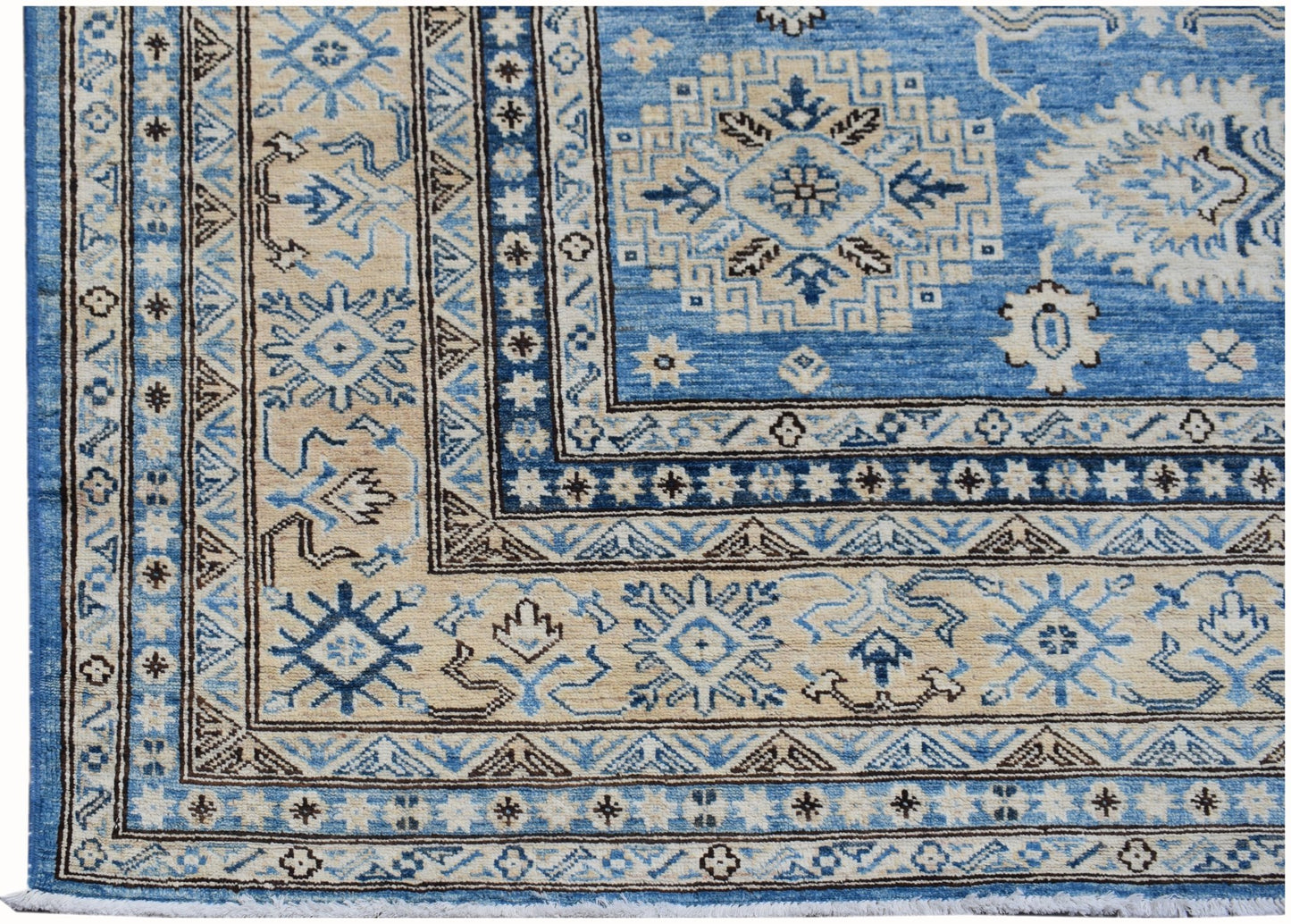 A handmade Afghan Super Kazakh rug featuring traditional geometric motifs in blue and beige.
