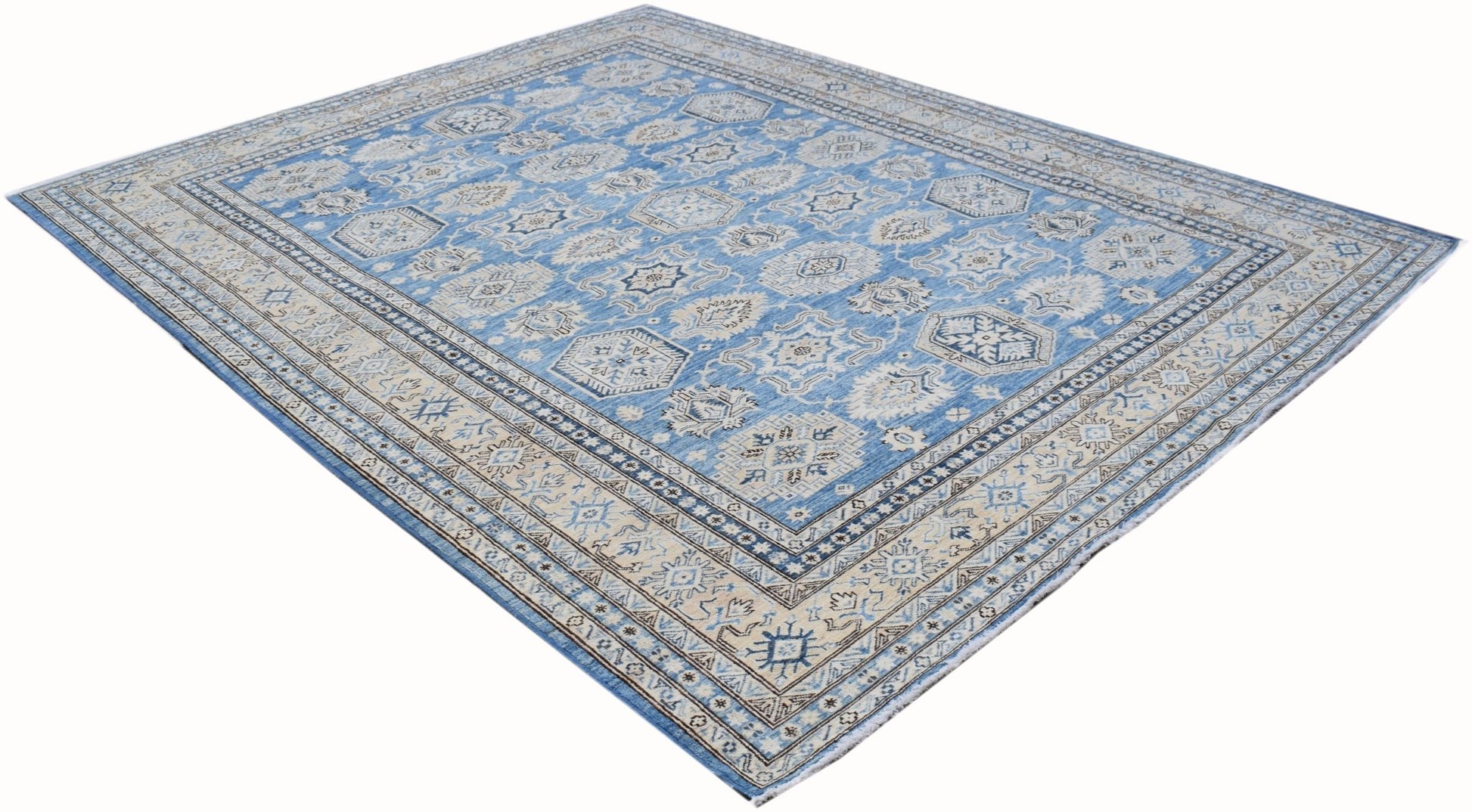 A handmade Afghan Super Kazakh rug featuring traditional geometric motifs in blue and cream tones.
