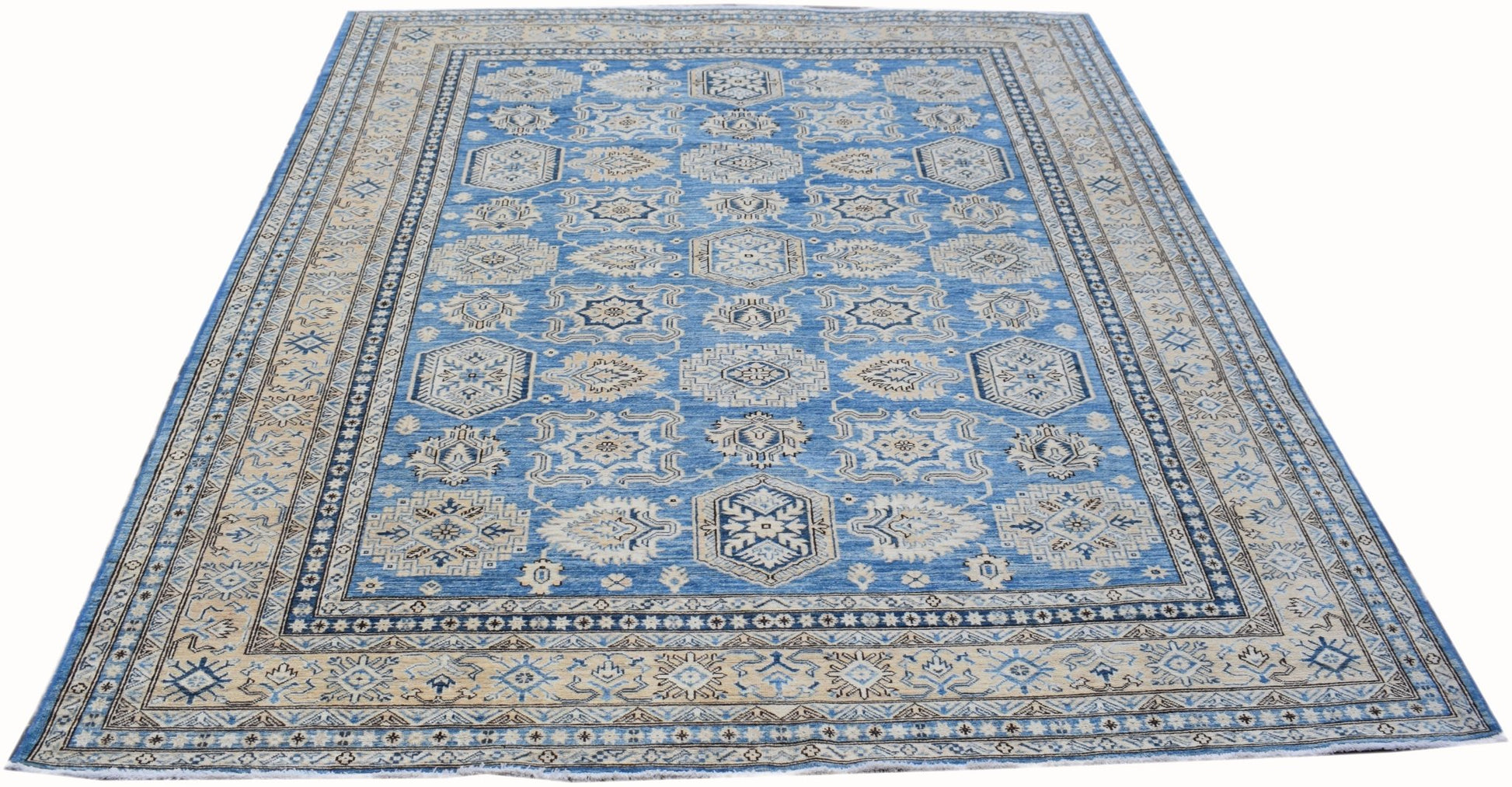 A handmade Afghan Super Kazakh rug featuring traditional geometric motifs in blue and cream.