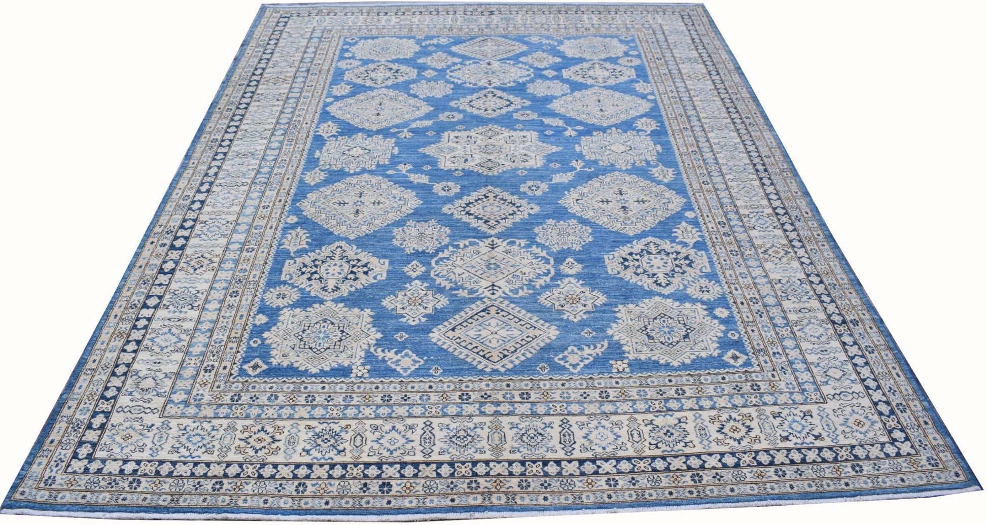 An Afghan Super Kazakh rug featuring traditional geometric motifs in blue and cream tones.