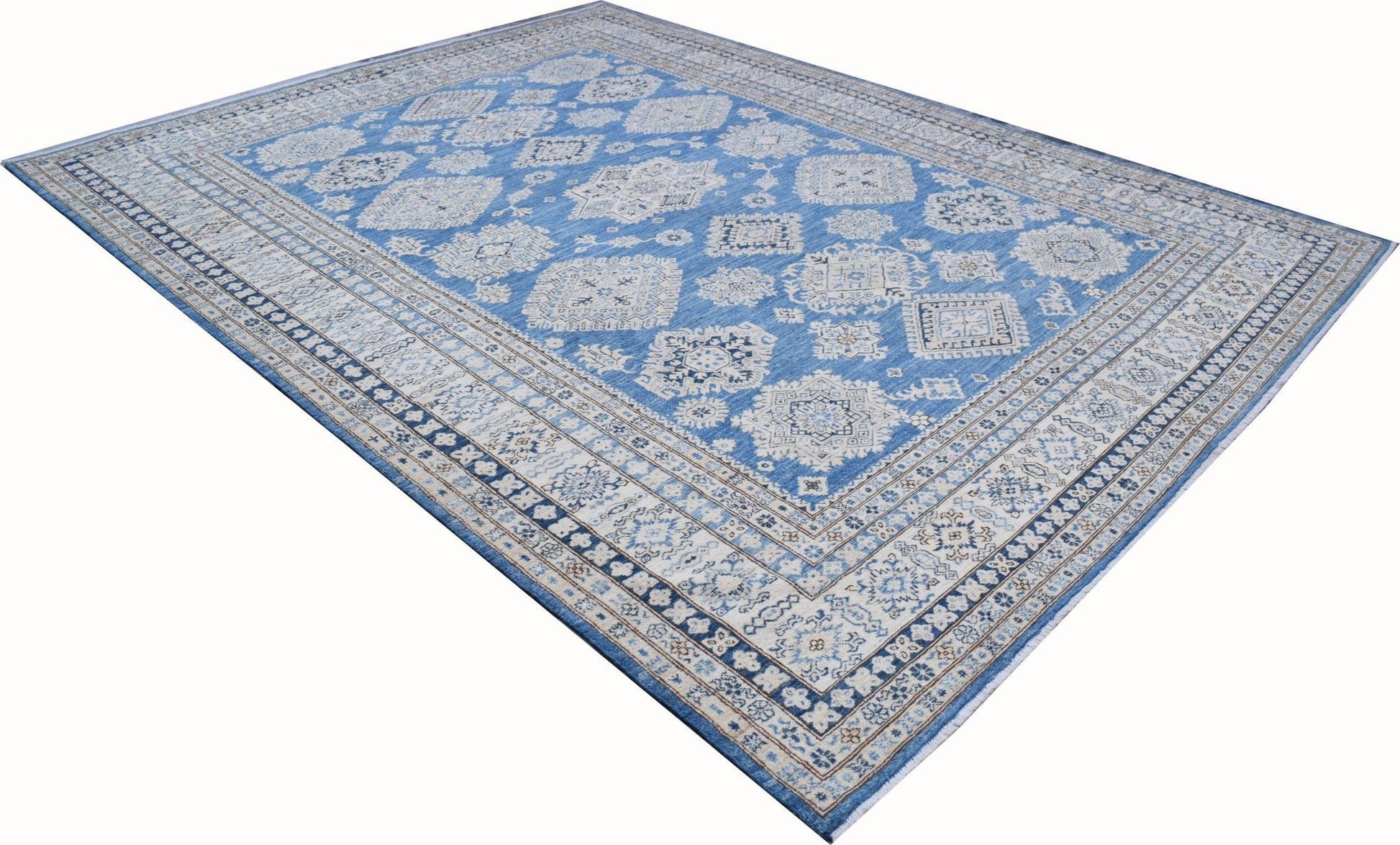 A handmade Afghan Super Kazakh rug featuring traditional geometric motifs in blue and cream tones.