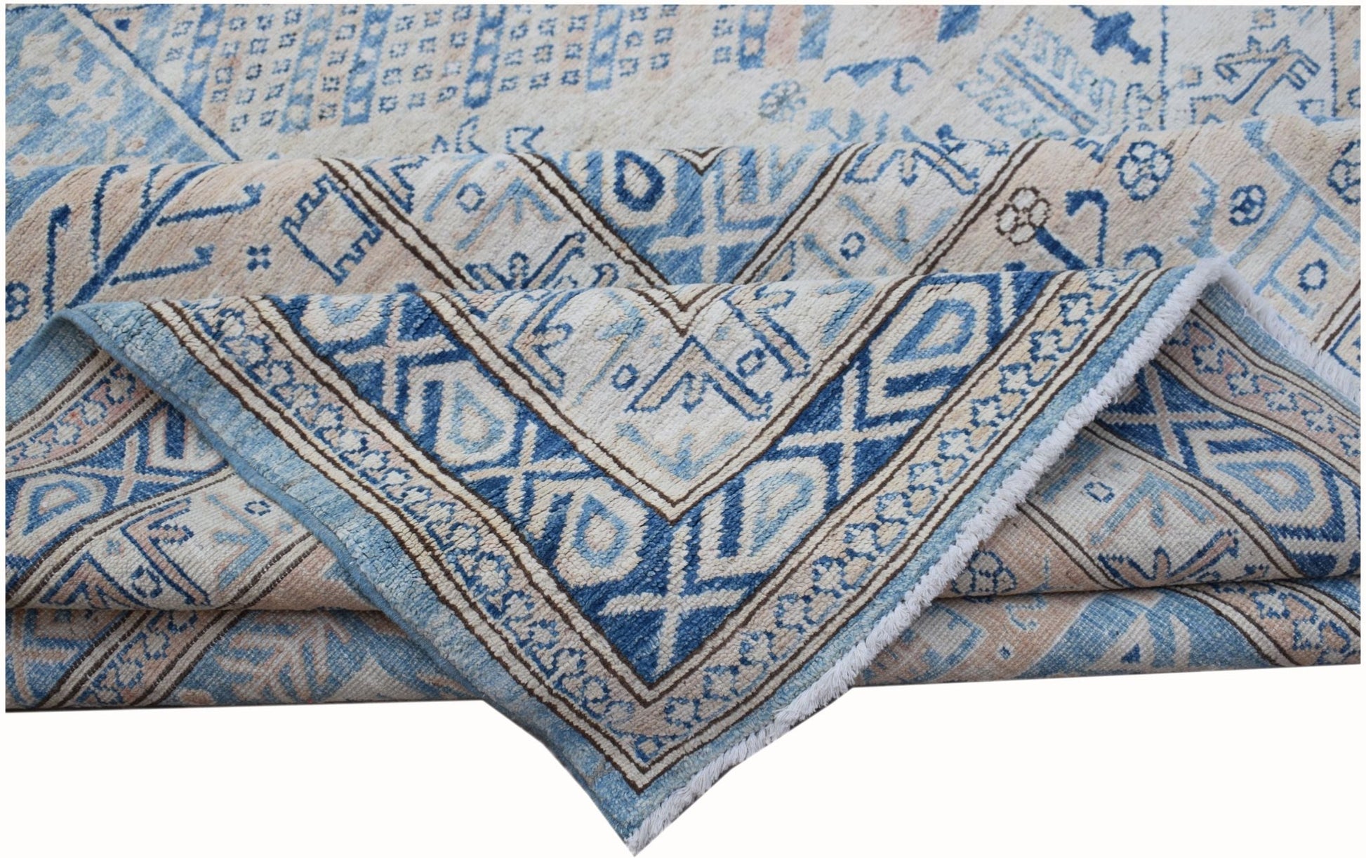 A handmade Afghan Super Kazakh rug featuring traditional blue and cream geometric patterns.