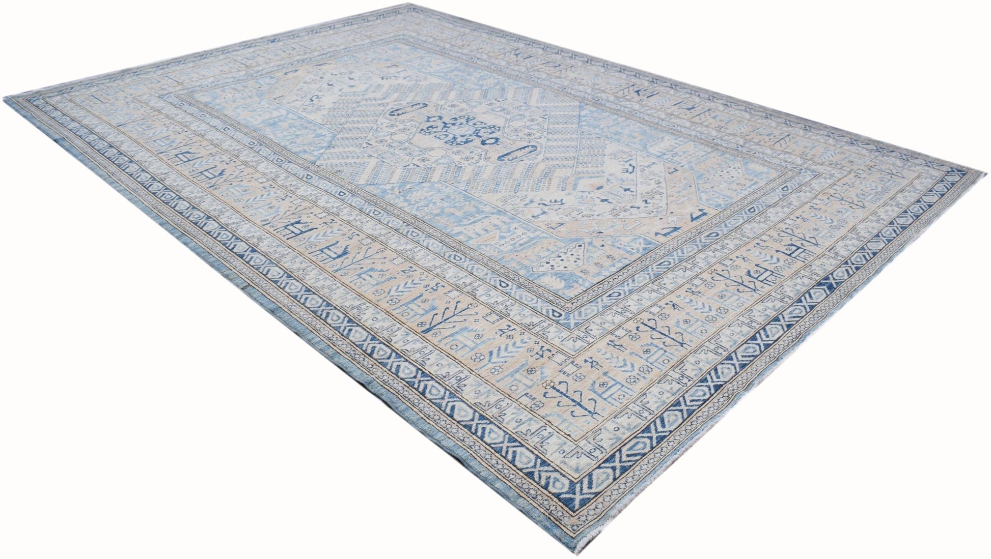 A handmade Afghan Super Kazakh rug featuring traditional blue and cream geometric patterns.