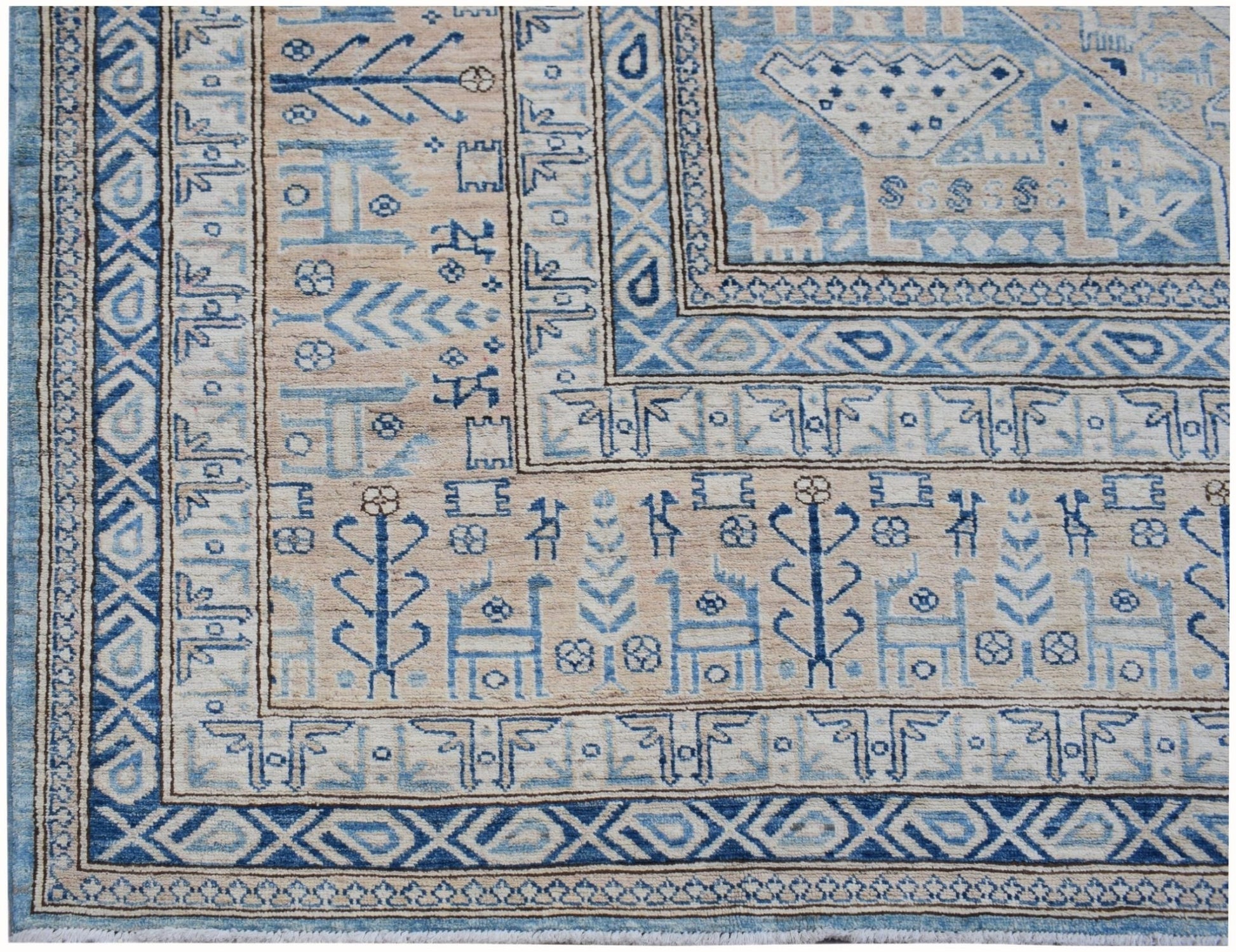 A handmade Afghan Super Kazakh rug featuring traditional blue and beige geometric motifs.