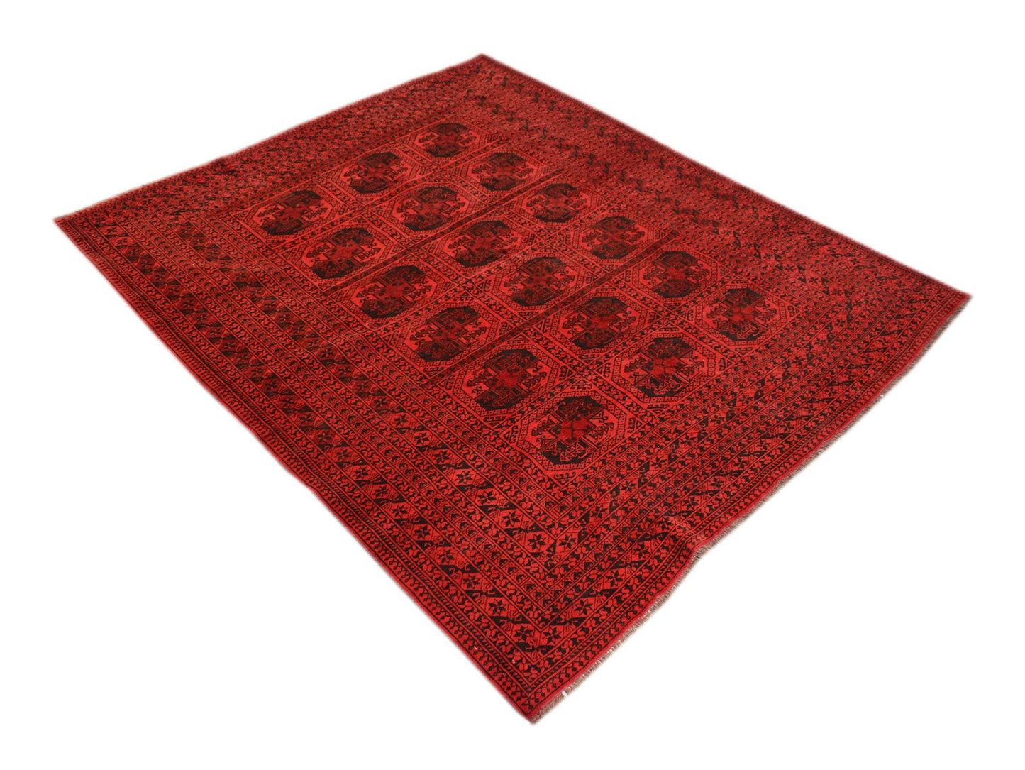 Vintage red Afghan Turkmen rug with black geometric patterns.