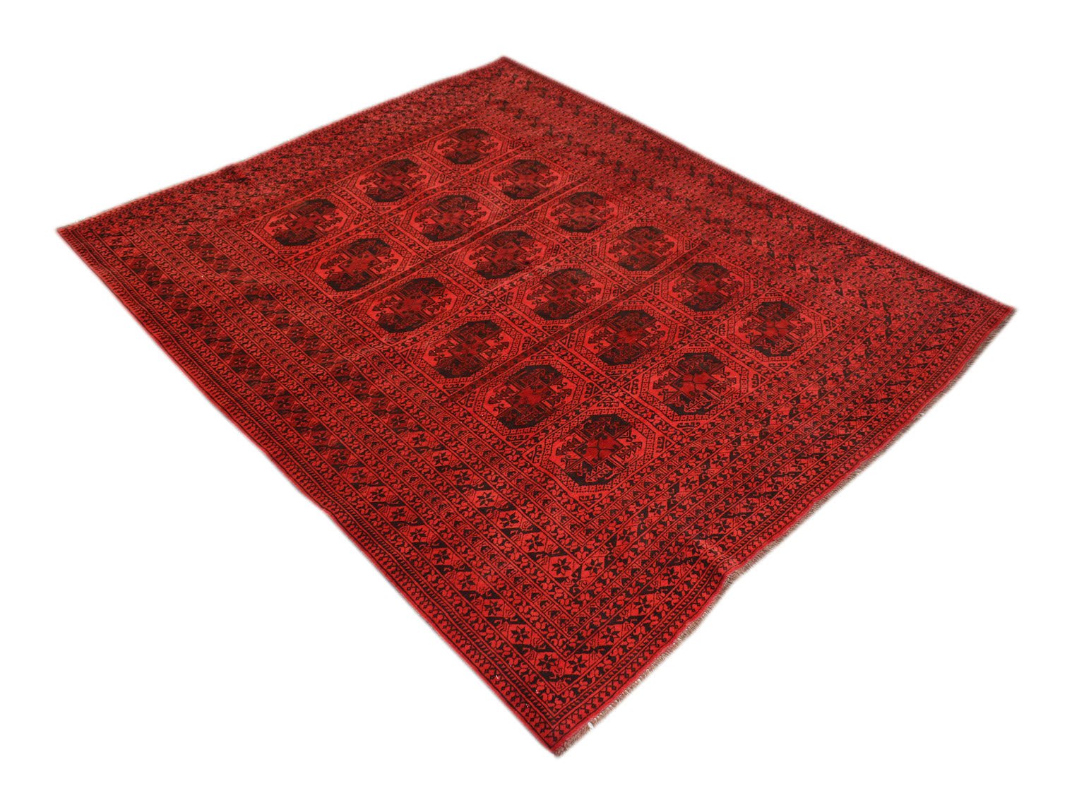 Vintage red Afghan Turkmen rug with black geometric patterns.