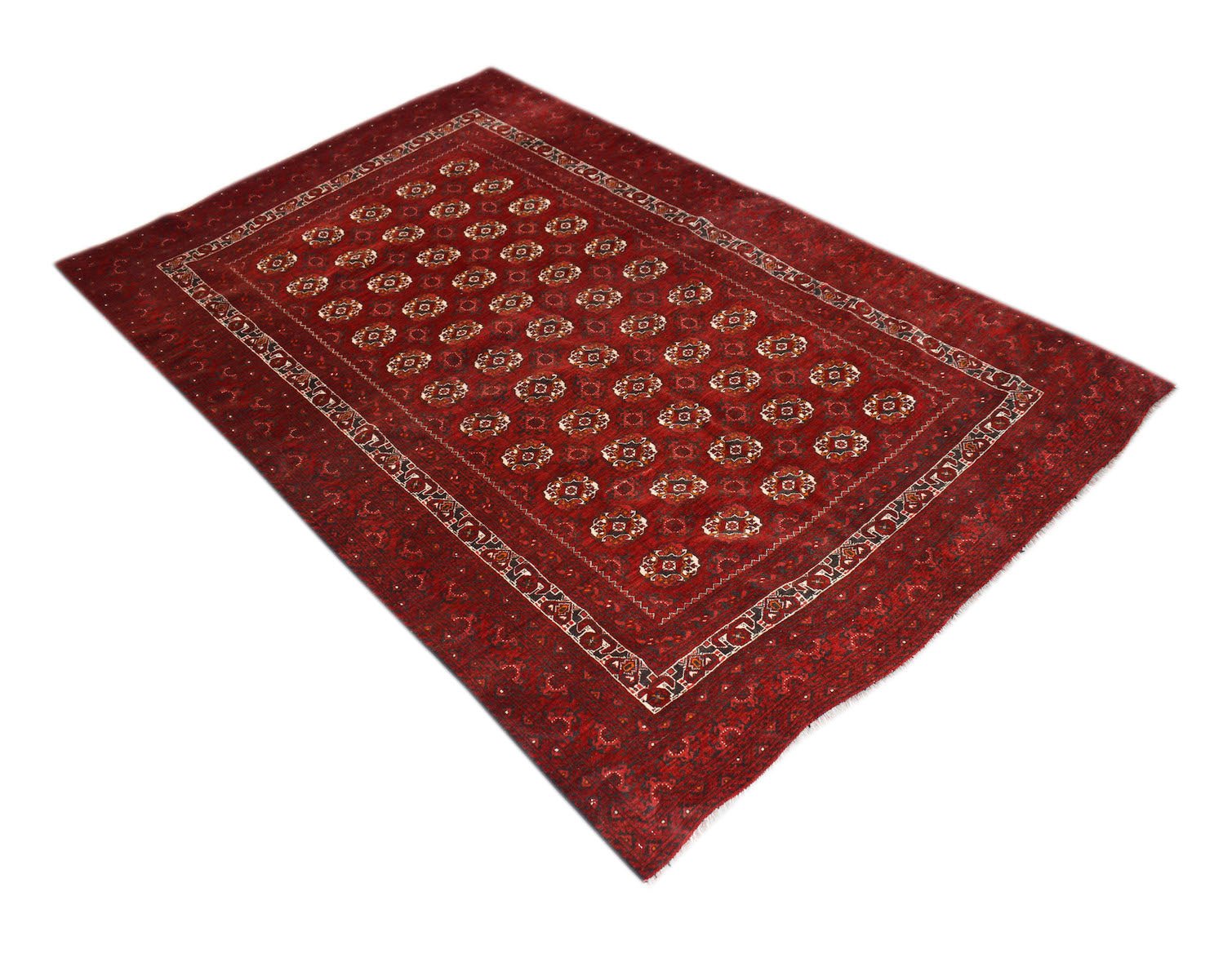 A vintage handmade Afghan Turkmen rug featuring a repeating geometric pattern in deep red tones.