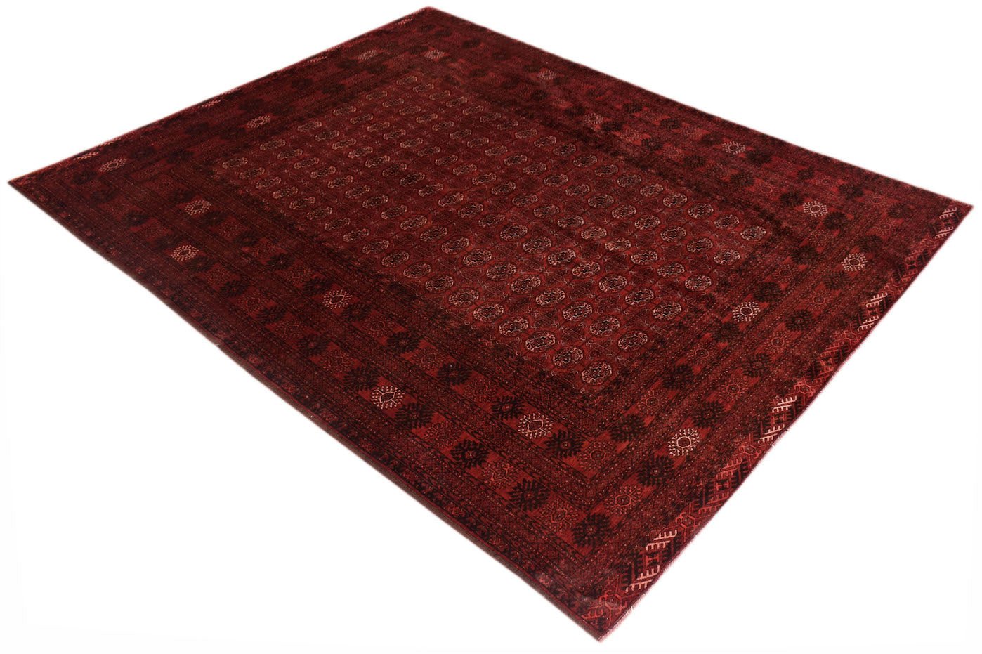 A vintage handmade Afghan Turkmen rug featuring a deep red field with repeating elephant foot motifs.
